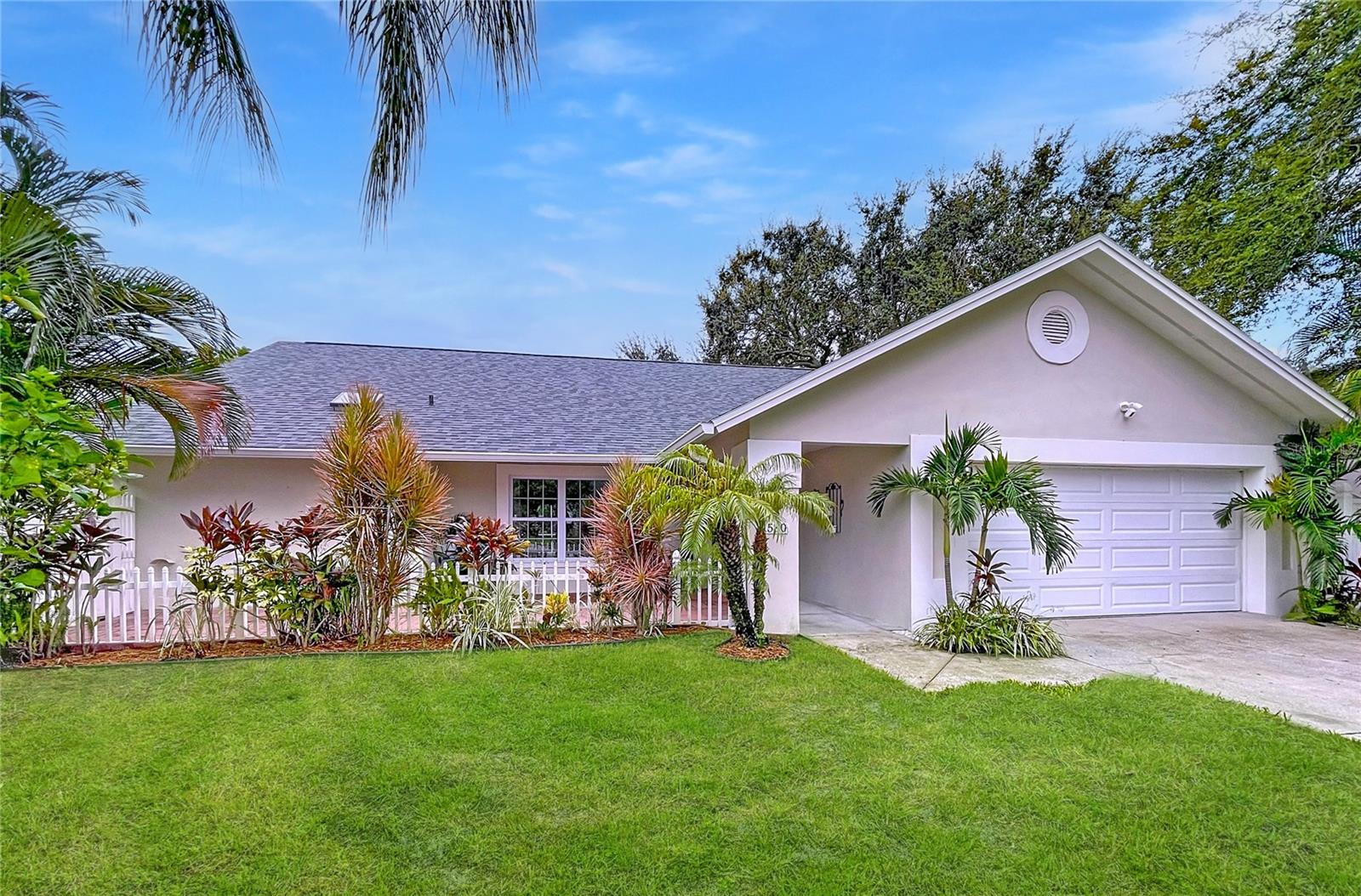 Under contract-accepting backup offers. Welcome to this beautifully remodeled 3 BEDROOM, 2 BATH POOL home tucked away on a CUL-DE-SAC in highly desirable Palm Harbor. From the moment you arrive, you’ll notice the fresh exterior paint, mature landscaping, and a welcoming oversized paver front patio. Step inside to soaring VAULTED CEILINGS, recessed lighting, and durable vinyl plank flooring that flows throughout the home. The OPEN-CONCEPT KITCHEN is a true showpiece with newer cabinetry, SOLID SURFACE counters, modern fixtures, and ALL newer APPLIANCES. Entertain easily with a breakfast bar overlooking the formal living and dining spaces. The primary suite features dramatic ceilings, a WALK-IN CLOSET, and a FULLY UPDATED BATH with dual vanity, spacious WALK-IN SHOWER and French doors that open directly to the pool. Your private backyard oasis includes a 13x30 SCREENED POOL with updated pump (5 years old) and filter (less than a year old), surrounded by lush landscaping and FRUIT TREES including mango, avocado, banana and guava. Additional updates include: NEW ROOF and HVAC, WATER HEATER (<3 years), WATER SOFTENER (<5 year), and WATER FILTER (<3 year). Located just MINUTES TO TOP-RATED SCHOOLS, beaches, shopping, and dining. This home blends modern updates with Florida living at its best.
