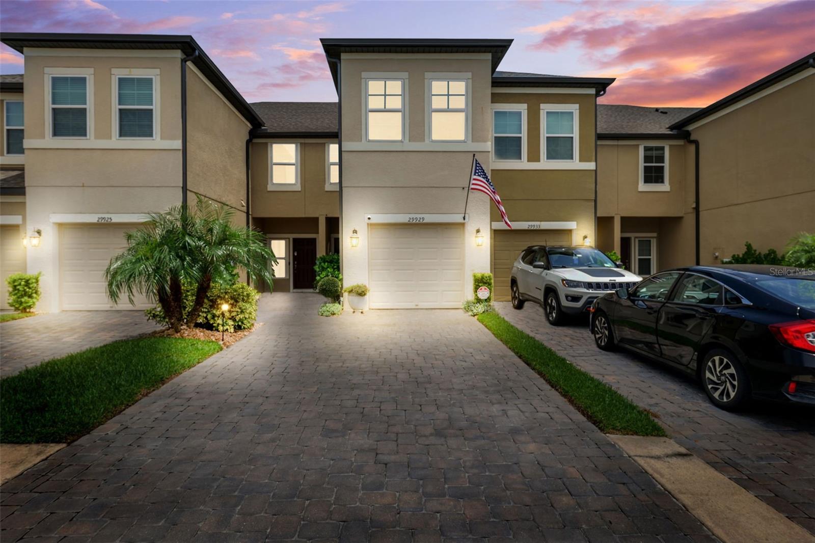 Welcome to Windermere Estates Townhomes—where comfort meets modern elegance in the heart of Wesley Chapel.This beautifully designed Andover II model offers the perfect blend of style and functionality, featuring 2 bedrooms, 2.5 baths, and a versatile loft that can easily convert into a 3rd bedroom or private office.Step inside to a welcoming foyer that flows into an upgraded kitchen, complete with stainless steel appliances—including a newer dishwasher and microwave—quartz countertops, and oversized cabinetry ideal for home-cooked meals. A convenient breakfast bar opens into a spacious dining area, perfect for entertaining, with a nearby powder room for guests.The open-concept living room is expansive and bright, highlighted by premium vinyl plank flooring and sliding glass doors that lead to a peaceful backyard patio—your own private oasis for morning coffee or evening relaxation. The attached one-car garage offers interior access, so you can stay dry while unloading groceries on a rainy day.Upstairs, you’ll find a large bonus loft offering endless possibilities—use it as a reading nook, workspace, or convert it into a 3rd bedroom. The centrally located laundry closet adds convenience, while the hallway leads to a well-appointed full bath with granite countertops, white subway tile, and matte black finishes. A generous secondary bedroom is ideal for guests or children.At the end of the hall, the private owner’s suite boasts two walk-in closets and a spa-like ensuite bathroom with an oversized walk-in shower, dual vanities, a private water closet, and a separate linen closet.Community & Location Highlights:Windermere Estates is a tranquil, well-maintained community located minutes from everything that makes Wesley Chapel one of Florida’s most sought-after destinations.Enjoy: The crystal-clear Epperson Lagoon (swimming, kayaking, paddleboarding). The Shops at Wiregrass and KRATE at The Grove for dining, shopping, and entertainment. Florida Hospital Center Ice, parks, trails, and nature preserves. Top-rated schools and easy access to I-75 & SR-56 for commuting-Whether you’re looking to relax or stay active, this location offers it all. Don’t miss the opportunity to make this beautiful townhome your own. Check out the 3D Interactive Virtual Tour and schedule your private showing today!