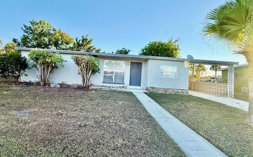 Charming home located in central Port Charlotte offers convenient access to nearby
shopping, dining, and entertainment, as well as 2 nearby hospitals and numerous
medical providers. This city water, city sewer home is move-in ready
with a 2021 metal roof. Home features 3 bedrooms and 1 bathroom, with a kitchen,
cozy living and dining area, as well as a bonus sun-room. Sure to catch attention is the
terrazzo flooring throughout the home. Lot is well landscaped with plants, shade trees,
and a picturesque backyard providing plenty of privacy and peaceful views. Home
features a carport, with outside closets for storage, as well as a utility closet for a
washer and dryer located off the backyard. Located near both US-41 and Interstate 75,
this attractive property is outside of flood zones and ready for someone to make it their
own to live the Florida lifestyle.