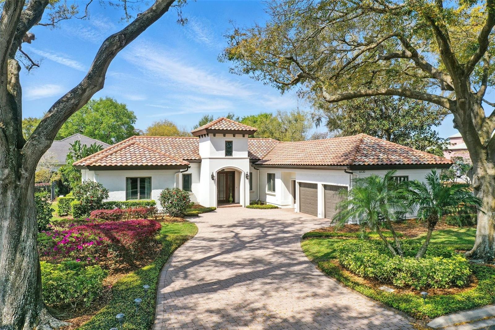 Isleworth - nestled in Windermere, this 600-acre community, is a prestigious residential enclave nestled along the Butler Chain of Lakes. This charming villa is in walking distance to Isleworth Golf & Country Club. Updated and boasting hardwood flooring throughout the main areas, and professional decorating, this functional and open floor plan has 4 ensuite bedrooms, kitchen with beautifully crafted cabinetry, formal dining, a spacious great room and office with an abundance of storage. Meticulously maintained and updated in 2011, there are newer AC units and tile roof, double-pane windows, new exterior painting, and much more. Also a spacious garage for cars and a golf cart. The back yard is private with block fencing. Perfect as a primary residence or vacation home. On-site home services are available for a carefree lifestyle. Isleworth Golf and Country Club, which is located within this gated/guarded community, offers various membership opportunities and is recognized as one of the Top 100 Platinum Clubs of the World. Also close to dining, shopping, top-rated public and private schools, expressways and tourist attractions making this the perfect choice to call home.