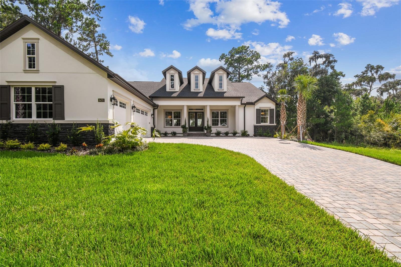 Pre-Construction. To be built. Build this beautiful luxury home by Vitale Homes! This Sawgrass model has everything and more of what you’ve been looking for with attention to detail! The double door entry into your foyer that features a nice, stepped tray ceiling with a nice size study with French doors and a tray ceiling. From the foyer you will see the living/dining/kitchen area, all with views to a huge lanai. The great room has a stepped tray ceiling, with crown molding and 4 panel sliding glass to the lanai area. Included features provide an oversized paver driveway, expansive front & rear porches, 10’ ceilings, 8’ interior doors, quartz counters in the kitchen and bathrooms, built-in appliances and a resort style owner’s suite. The kitchen has a massive island with cabinets on the front and back of the island, quartz counters, trendy pull out faucet, tiled backsplash and large walk-in pantry. The shaker style white cabinets have soft close features, 42” uppers, gold cabinet hardware and a decorative hood over the cooktop. You will love the new appliance designs with gold door handles for the double oven, dishwasher and refrigerator, plus a 5-burner gas cooktop. The owner’s suite has several large windows for natural light, 3 large walk-in closets, a free-standing tub with a nice size, tiled shower surrounded with a frameless glass enclosure, private commode and vanity with two sinks. Guest bedroom 2 has its own private bathroom and walk-in closet and Guest bedroom 3 has a pool bath with a shower just outside of the bedroom door. Designer light fixtures, 5-inch baseboards and wood casing windowsills offer more luxury features. The laundry room is a nice size and has the same luxury features with a base cabinet laundry tub, quartz counters and upper cabinets. The garage has high ceilings, an overhead door on the side of the garage for your golf cart and the floors are finished with the flaked epoxy finish. The energy rating on this home will be great with 2 separate HVAC units, insulated foam block and thermal windows. We have more details to show you when you visit, so contact the community agent for your private tour or more information. This magnificent home represents a once-in-a-lifetime opportunity to indulge in the ultimate country club lifestyle, combining the allure of a golf club community with the finest amenities and unmatched natural beauty. Southern Hills Plantation offers a very private 18-hole signature Pete Dye Championship Golf course, manned gated community, driving range & 6-hole short course, two on-site restaurants, fitness center, swimming pool, tennis & pickleball. Price does not include lot premiums.
