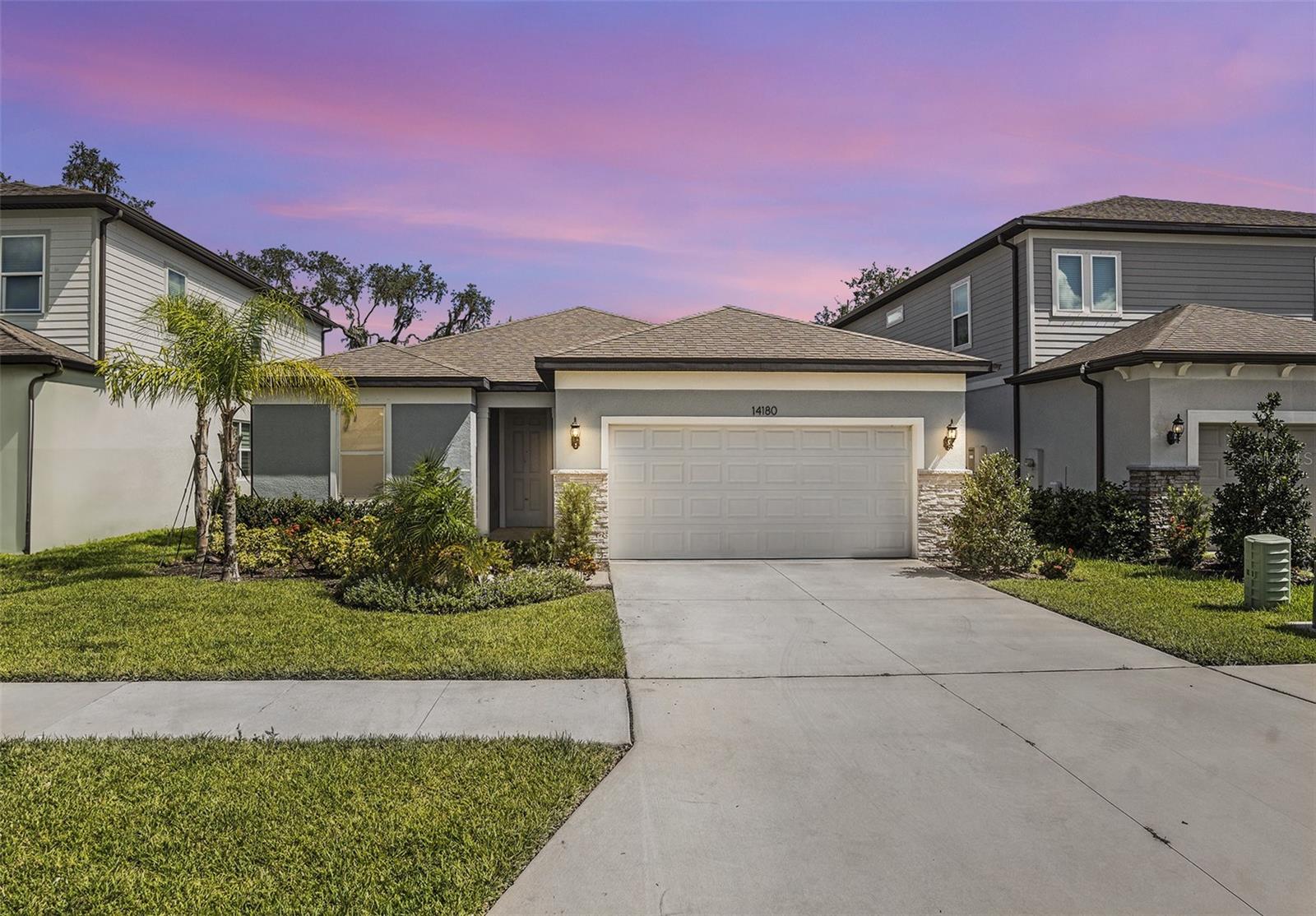 One or more photo(s) has been virtually staged. Welcome to the highly sought-after Hammock Crest community of Riverview, FL! This stunning 4-bedroom, 3-bathroom residence was built in 2024 —offering the perfect blend of modern style, comfort, and functionality.
Step inside to discover a thoughtfully designed three-way split bedroom layout, providing privacy and space for the whole family. The home features wood-look laminate flooring in the main living area, tile throughout, and cozy carpet in the bedrooms.
The heart of the home is the open-concept kitchen, living, and dining area, perfect for entertaining or everyday living. The gourmet kitchen is a chef’s delight, boasting quartz countertops, a large center island with seating and prep space, and stainless steel appliances—including a gas range.
Enjoy seamless indoor-outdoor living with sliding glass doors that lead to a spacious covered patio, ideal for relaxing or hosting guests.
The private primary suite is tucked at the back of the home and features a luxurious en-suite bathroom with a dual-sink vanity, oversized walk-in shower, private water closet, and a large walk-in closet.
Two of the generously sized bedrooms share a full bath with a tub/shower combo, while the fourth bedroom offers added privacy with its own en-suite bath.
Ideally situated near top-rated Hillsborough County schools, shopping, dining, and major highways, this location offers a quick and easy commute to Tampa and surrounding areas.
Don’t miss your chance to own a brand new, never-lived-in home in one of Riverview’s most desirable communities—schedule your private showing today!