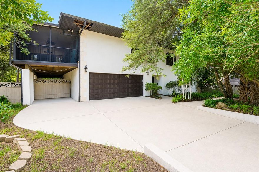Tucked beneath mature oak trees on one of Ormond-by-the-Sea's most
distinctive streets, this spacious 4-bedroom, 4-bath home is located just a
half block from the no-drive beach and the Halifax River.
Offering 2,824 living square feet and more than 4,100 total square feet, the
flexible layout includes four bedrooms, each with its own en suite bath and
walk-in closet, with two bedrooms upstairs and two downstairs—ideal for
guests, multi-generational living, or work-from-home flexibility. A stairwell
lined with pecky cypress adds warmth and distinctive Old Florida
character.
The upstairs living area features a spacious great room and kitchen with
Kenmore Elite appliances, gas cooktop, and ventless propane fireplace
with fruitwood mantle. Outdoor living includes a large screened porch and
a 564-square-foot upper deck overlooking the wooded surroundings. Set
on an oversized 11,700-square-foot lot, the property offers a shaded yard
with exceptional privacy and room for a pool.
Major updates include a new roof (2023) and 4-ton Carrier HVAC system
(2021). Additional features include 5-foot eaves, an oversized 3-car
garage/workshop, and paved storage area for a boat, RV, or golf cart.
Located outside the flood zone, this home is a rare opportunity to enjoy
beachside living on an oversized lot beneath a canopy of mature oaks.