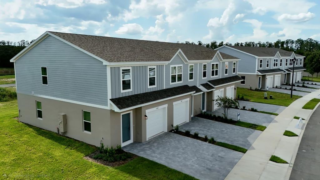 Photo of 1602 Fan Palm Drive, Davenport, FL 33897 (MLS # O6367361)