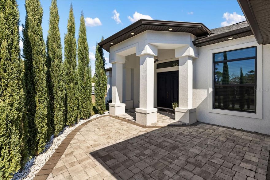 Affordable Luxury in the PRIME LOCATION of North Port, Florida! Discover refined living in this beautifully designed home offering over 2,700 square feet of thoughtfully crafted space. With high-end finishes this property delivers comfort, style, and value all in one. 4 Generously Sized Bedrooms, 2 Well-Appointed Bathrooms and 2-Car Garage! From the moment you step inside, you'll notice the impressive high and tray ceilings that enhance the open, airy layout. The main living area is warm and inviting, featuring an electric fireplace with custom built-ins-perfect for cozy evenings or hosting guests. The chef-inspired kitchen is a true showpiece, boasting sleek quartz countertops and quartz backsplash, a large waterfall island, high end appliances makes perfect space for entertaining. The luxurious primary suite offers a spacious retreat featuring a large walk-in closet, dual vanities, stunning freestanding soaking tub, and a beautifully designed walk-in shower for a true spa-like experience. Two well-appointed guest bedrooms, offering comfort and convenience for family and or visitors. An additional - 4th versatile bedroom provides the perfect space for a private home office, study, or extra guest room to suit your needs. A convenient indoor laundry room adds everyday functionality. Enjoy added value with a whole-house R/O REVERSES OSMOSIS SYSTEM insuring quality water throughout the home. Step out to the & screened lanai and unwind in your private partially fenced backyard retreat. Backing up to a peaceful canal - you'll appreciate the added privacy and relaxing water views. Ideally situated in North Port, FL with an easy access to I-75 you're just minutes from the future Sarasota Memorial Hospital, shopping, dining, Downtown Wellen Park, North Port Aquatic Park, and the beautiful Gulf Coast beaches. No HOA's, no CDD's. This home combines elegance, comfort, and location-don't miss the opportunity to make it yours!