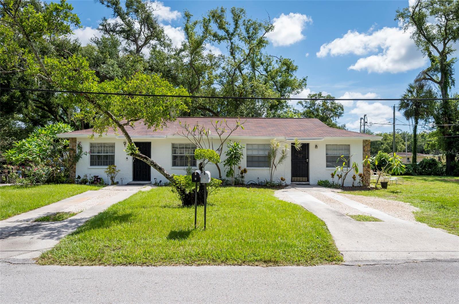 OPPORTUNITY ZONE! Fantastic investment or house hacking opportunity! Non smoking, no pets, block construction, newer roof, brand new septic and drain field, clean 4 point, not in a flood zone, no damage from recent storms, and no flood insurance required, low traffic noise with quick access to Tampa and major roads. HUGE .27 acre corner lot surrounded by mostly single family homes. Some cosmetic value-add potential. Both sides are rented to stable long-term tenants at less than half of market rent. They’d love to stay, but understand the property is being sold and rents will go up. Month-to-month leases now. 2/1 each side with plenty of outdoor space for each side. Please no assignable contracts, sight unseen offers, subject to, or seller finance offers. Must have proof of funds/financing before showing.