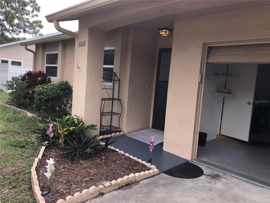 Lovely Dwelling Awaits Your Gentle Hand. 6026 Georgia Avenue, New Port Richey, FL A home with heart and accessibility, designed for comfort and ease.. Handicap-accessible ramp and wheelchair-friendly design. Spacious 2 bedrooms / 1 full bath – bright, clean, and cozy. Secure garage bay for parking or storage; back screened patio.. Front and back yard – a green canvas for gardening or relaxing. Back balcony/perch for fresh breezes and quiet evenings. Live in one unit and rent the other for added income! Walk to Downtown New Port Richey! Shops, dining, parks, and the scenic riverwalk just steps away A vibrant community atmosphere with charm and convenience. Only the individual willing to take care the property should apply.