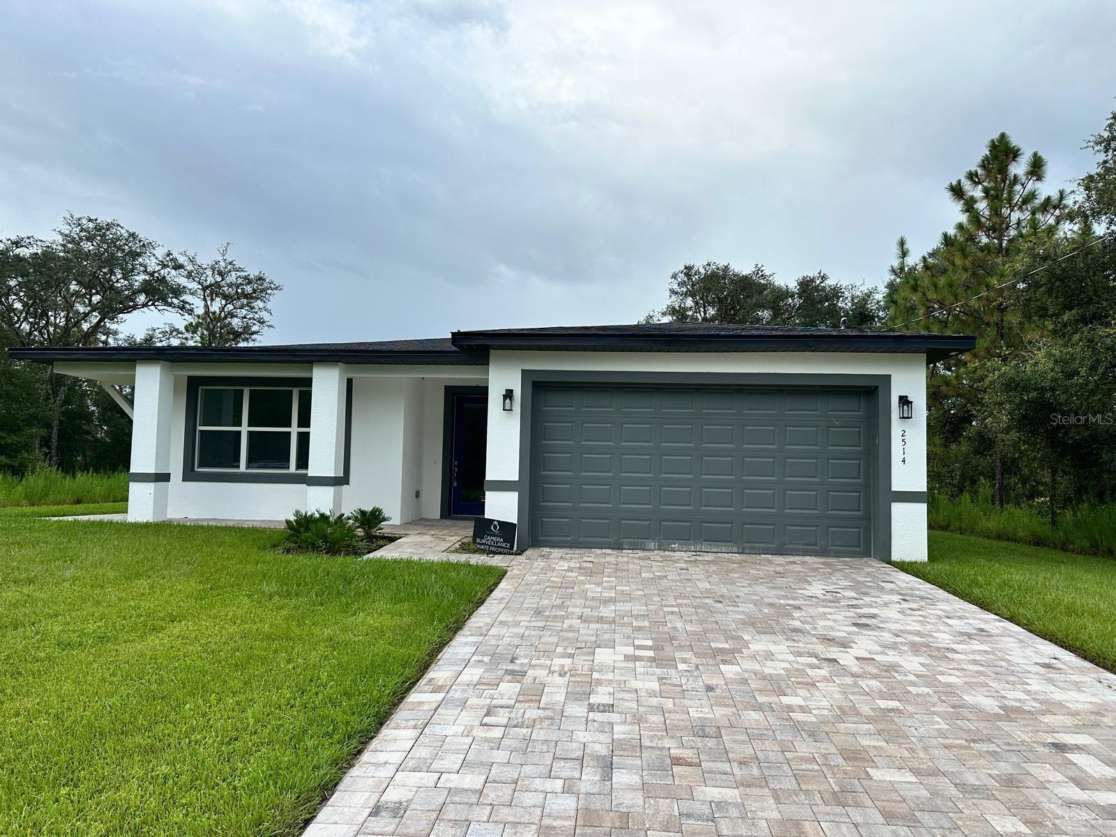 Welcome to the New Construction 3/2.5 main home, now available for rent in the beautiful Citrus Springs, FL! **There is a 1/1 attached suite that has a separate private entrance that will be rented separately and is NOT included with this rental.**
This stunning home boasts three spacious bedrooms and two and a half bathrooms, offering ample space for comfortable living. The open floor plan, complemented by high ceilings and wood look laminate flooring throughout, creates a seamless flow from room to room. The kitchen is a chef's dream, featuring 42" cabinets, granite countertops, and stainless steel appliances. The two-car garage provides plenty of storage space, while the paved driveway and entrance add a touch of elegance to the property. The home is also equipped with foam insulation for energy efficiency. Outside, you'll find a meticulously manicured lawn, adding to the overall charm of this new construction. Don't miss out on this opportunity to rent a brand-new home in Citrus Springs!
The utilities will remain in the Landlords name and be split 80/20 between the main house and the 1/1 suite. Tenant of the main house will pay 80% of the utilities every month. The charge will be added to their tenant ledger to pay. Tenant of the main house is responsible for 100% of the lawn maintenance. Tenant of the main house has exclusive access to the garage and driveway and mailbox.
** Tenant will need to provide their own washer and dryer.
** RENTERS INSURANCE REQUIRED, Min $100k Liability coverage. Personal property coverage is optional **
All residents are enrolled in the Resident Benefits Package (RBP) for $35.00/month which includes credit building to help boost the resident’s credit score with timely rent payments, up to $1M Identity Theft Protection, HVAC air filter delivery, move-in concierge service making utility connection and home service setup a breeze during your move-in, our best-in-class resident rewards program, and much more! More details upon application.
If approved for this home, new tenants must pay a $200.00 lease coordination fee due at the same time as the security deposit payment.