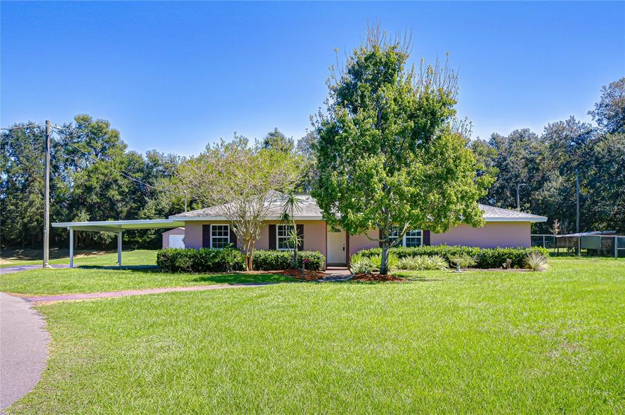 Country Living Meets Modern Comfort in Hickory Hills! Tucked away on just over an acre on the peaceful outskirts of Dade City, this beautifully remodeled home in Hickory Hills offers the perfect blend of space, style, and serenity. From the moment you pull into the drive, you’ll feel the quiet calm of country living with all the modern upgrades already done for you. Step inside, and you’ll instantly see the transformation. Fully renovated in 2025, this home feels brand new featuring a stunning new kitchen with all-new cabinets, updated bathrooms, fresh interior paint, and sleek tile flooring throughout. The split-bedroom layout offers privacy for everyone, while the indoor laundry closet keeps daily living convenient and tidy.For those who love to entertain or simply unwind at home, the outdoor space is a dream come true. The screened lanai opens to your inground pool, perfect for weekend gatherings or quiet evening swims. There’s even a pool table ready for fun and laughter when friends stop by. The one-car garage is vented with A/C, making it ideal for a workshop, hobby room, or home gym. You’ll also enjoy a two-car covered carport, a storage shed, and a fenced area where your dog can run freely. Out back there is a concrete pad with a basketball hoop adds yet another touch of fun to this well-rounded property. Every detail here has been thoughtfully updated, giving you the rare opportunity to move right in and start living your best life in a home that truly has it all space, privacy, and personality. There is something for everyone here! This home isn’t just a place to live it’s a place to grow, gather, and make lasting memories. Located  just minutes from charming downtown Dade City you’ll enjoy small-town living with easy access to shops, dining, and major roadways. Call today before you miss out on the perfect opportunity to call this HOME!