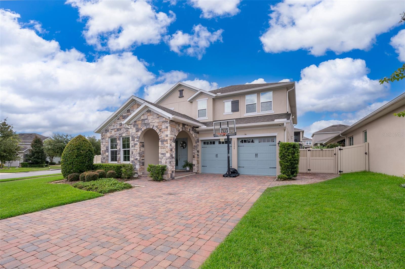 Stunning 5BR/4.5BA home on the largest corner lot in Highlands at Summerlake Groves. This beautifully upgraded residence features new high-end laminate flooring, a redesigned kitchen with updated cabinetry, and built-in closets in every bedroom. The office is enhanced with custom built-ins, and the home is equipped with a whole-house water purifier system.
The spacious living room offers a wet bar with ice maker and refrigerator, perfect for entertaining. An in-law suite provides a private retreat with its own en-suite bath and walk-in closet. Upstairs, the second-floor balcony overlooks the community and delivers breathtaking views of Disney’s nightly fireworks, creating the ultimate Florida lifestyle. The property is fully fenced for added privacy and outdoor enjoyment.
Community amenities include a resort-style pool and cabana, tennis courts, dog park, two playground for families, walking and biking trails, and a mini soccer field. Ideally located next to Orange County National Golf Center, and just minutes from Hamlin Town Center, Disney parks, shopping, dining, and top-rated A-schools.