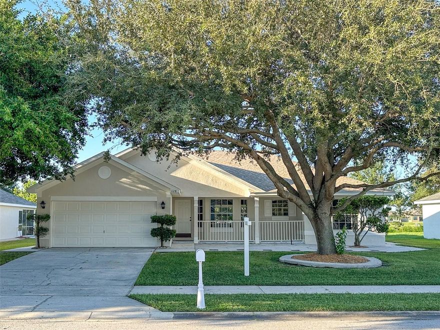 One or more photo(s) has been virtually staged. NEWLY PAINTED EXTERIOR, and NEWLY IMPROVED PRICE! WELCOME to this 3 bedroom, 2 bathroom single story home in the highly desirable Lake Place neighborhood on a cul de sac that ends at Lake Parker. Beautifully remodeled open concept kitchen with high ceilings, stainless steel appliances, gorgeous quartz counters, solid wood cabinets, and tiled flooring. Great room has an open, spacious feel with vaulted ceiling, engineered hardwood flooring, and views out to the large screened back porch and back yard. All bedrooms have engineered hardwood flooring - no carpet! Both bathrooms have been remodeled with attractive tiled showers and quartz counters. Spacious back porch (14 ft by 54 ft) is perfect for relaxing and entertaining, and the back yard could easily accommodate a pool. Lake Place is a well-kept one-street subdivision with no HOA and no through traffic. Conveniently located near shopping, dining, great schools, downtown Lakeland, and I-4. Plus there's a wooden dock at the end of this dead-end street on beautiful Lake Parker, which covers over 2000 acres.