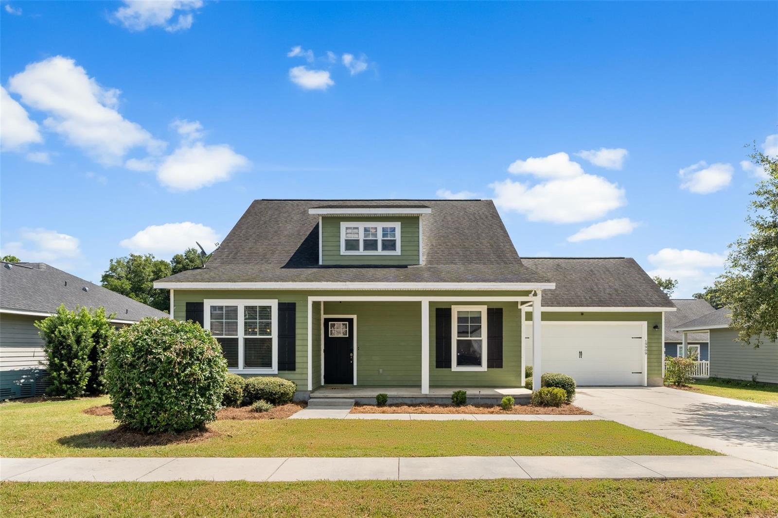 Welcome to this beautiful 4-bedroom, 2.5-bathroom home offering over 2,000 sq ft of living space in the charming historic town of High Springs, FL! Built in 2016, this two-story home combines modern upgrades with a warm, inviting layout. Step inside to find a spacious open-concept floor plan with updated LVP flooring downstairs. The heart of the home features a custom-built fireplace, a stylish kitchen with granite counters, soft-close drawers and stainless steel appliances - perfect for entertaining. A formal dining room adds an elegant touch. The primary suite and an additional guest bedroom are conveniently located on the first floor, along with a half bath. Upstairs, you’ll find two spacious bedrooms, bathroom, plus a bonus loft area, ideal for a home office, playroom, or additional living space. Enjoy Florida living in the fenced backyard, perfect for relaxing on the weekends. All of this is located just minutes from beautiful freshwater springs, local shops, and dining, with an easy commute to Gainesville. Don’t miss your chance to own this stunning home in one of North Florida’s most desirable small towns!