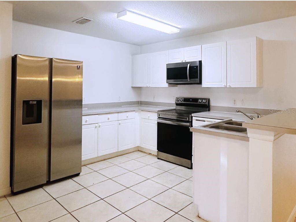 Photo of 2770 Club Cortile Circle #A, Kissimmee, FL 34746 (MLS # O6432997)