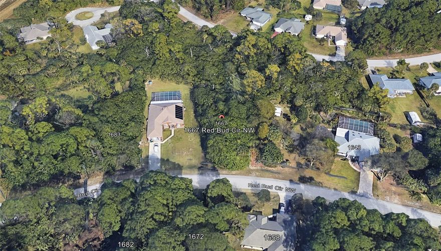 Oversized lot! Located in a growing residential area of Palm Bay, 1667 Red Bud Circle NW presents a great opportunity to build your custom home in a quiet neighborhood surrounded by both established homes and new construction. This vacant homesite offers a blank canvas to design a residence that reflects your style while enjoying the space and privacy that make this area desirable. The property is positioned in the northwest area of Palm Bay, a part of the city that continues to see steady growth and development. With no existing structure, you have the flexibility to create a home that fits your vision—whether that includes spacious indoor living, outdoor entertaining areas, or room to enjoy Florida’s year-round sunshine. Convenience is another key highlight of this location. The lot provides easy access to shopping, dining, parks, and major roadways, making daily errands and commuting simple. Residents also enjoy being within reach of the many attractions of Brevard County, including the nearby Space Coast, beautiful Atlantic beaches, and expanding employment centers throughout the region. As Palm Bay continues to grow, opportunities to secure residential land in developing neighborhoods are becoming increasingly valuable. Whether you are planning to build now or invest for the future, 1667 Red Bud Circle NW offers location, potential, and the chance to create something truly your own in one of the area’s emerging communities.