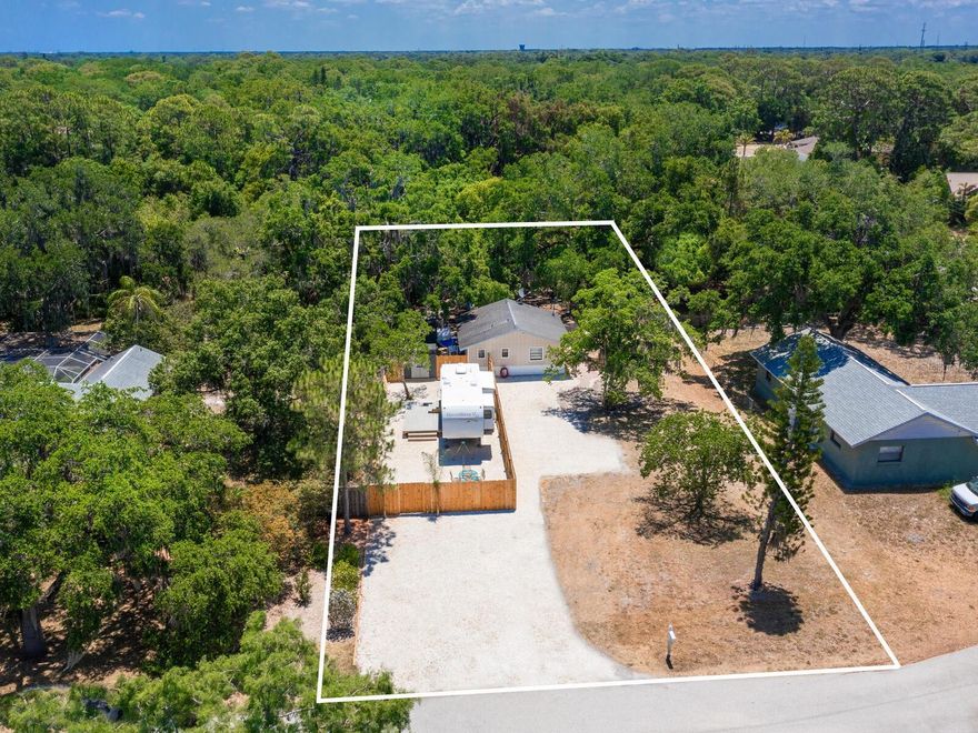 Explore a rare vacant-land opportunity with built-in bonus cottage! Welcome to a unique find in the heart of Sarasota, an oversized ¼-acre lot in the desirable Tobero Woods neighborhood (34235) that opens the door to your vision. Whether you’re ready to build your dream residence, explore multi-home possibilities or simply secure prime land for the future, this property invites imagination and flexibility. On a quiet street, you’ll find this smoothly preserved site features a charming, turnkey one-bedroom, one-bath, 576-square-foot cottage built in 1979, freshly painted inside and out with a new roof, upgraded appliances and a completely cleaned backyard. Use it immediately as an income-producer, guest house or full-time residence while you plan the big build. Zoned RSF2, on a generous lot with mature oak trees, and offering a rare live now while you build later scenario. Live in the cottage, let it pay for itself, and when you’re ready draw permits for the main home, ADU, pool and more. Highlight features include spacious parcel in a desired Sarasota location, more land than most one-bed homes offer. One-bedroom, one-bath cottage with updated tile floors, open layout and move-in readiness. New roof, fresh paint and pristine backyard, turnkey comfort meets future potential. Cul-de-sac setting for tranquility plus convenient to Sarasota’s dining, shopping and the Gulf. Instruments of flexibility such as live now, build later, convert to ADU or rental. Ideal for dream home seekers, land investors, Airbnb hosts (check local zoning/reg), or anyone looking to buy land in Sarasota with an immediate living option. Don’t miss this rare blend of vacant land potential plus immediate cottage utility, a smartly positioned asset in Sarasota’s evolving market.
