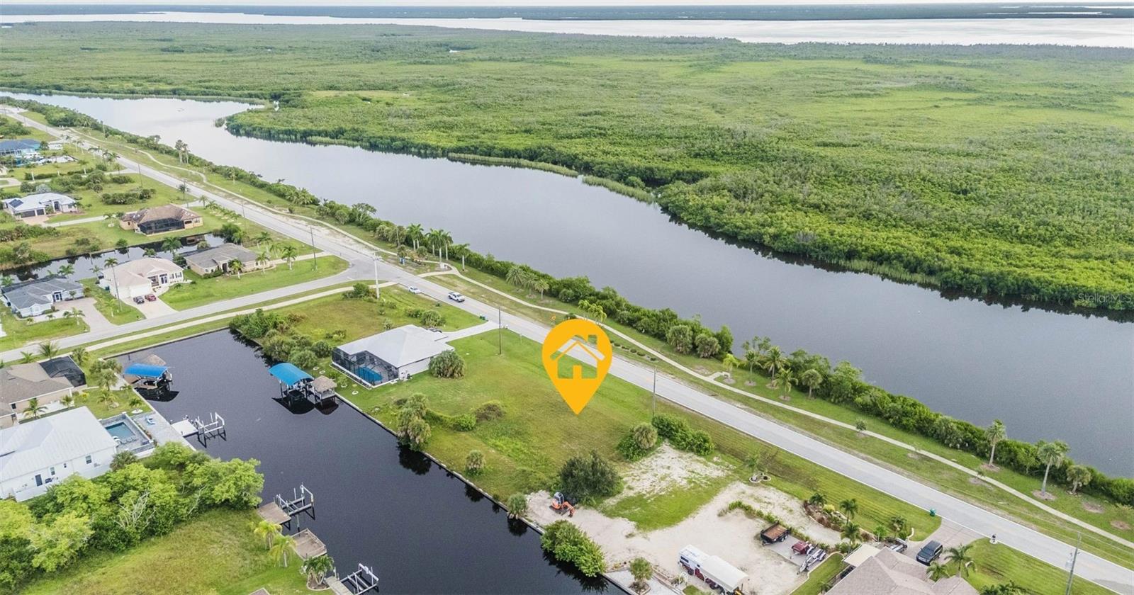 Discover your slice of paradise with this stunning Gulf access waterfront parcel nestled in the highly sought-after boating community of South Gulf Cove. This property features a backyard canal that stretches an impressive 80 feet wide, of concrete seawall. Perfect for docking your boat and enjoying tranquil water views. With public water and sewer services readily available, building your dream home has never been easier. Enjoy the convenience of quick access to the lock, allowing you to set sail to Charlotte Harbor and the Gulf of Mexico in moments. Explore the area's pristine Gulf beaches, a variety of dining options, shopping venues, and numerous golf courses that cater to every enthusiast. Embrace nature with nearby public parks, inviting bike and walking paths, and a picturesque lagoon coupled with a wildlife conservation area just across the street. Plus, don't miss the chance to acquire the adjacent waterfront lot available for sale. Experience the ultimate Florida lifestyle—your waterfront dream awaits!