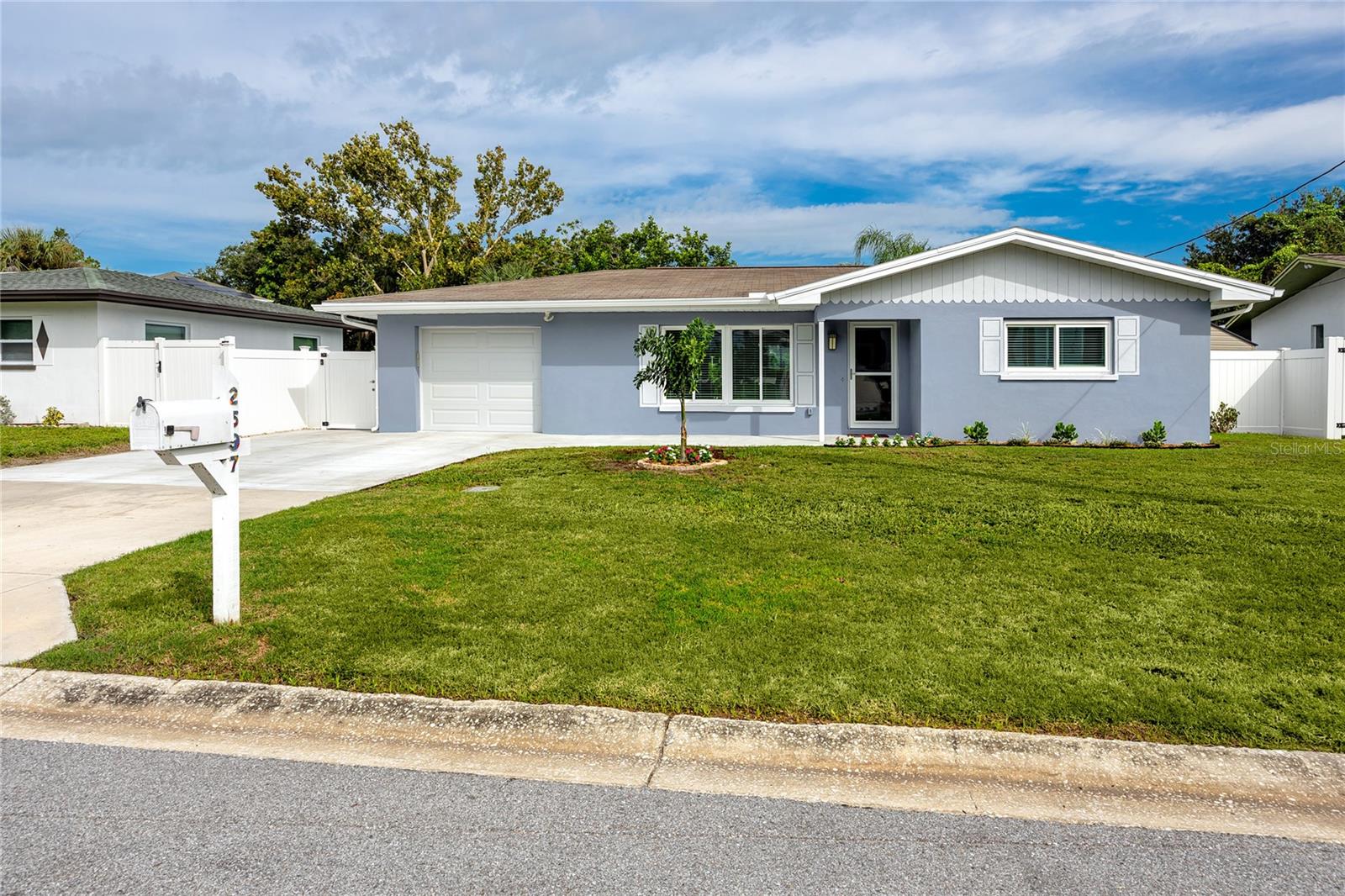 2 MILES to BELLEAIR BEACH! And Breathtakingly Beautiful!! STUNNINGLY REMODELED!! This BLOCK 3 bedroom, 2 bath home has 8 ft ceilings - none of which have popcorn- is nestled alongside the picturesque McKay Creek. 70'x126' spacious lot! From the moment you enter, you are swept to the graceful color schemes of the FABULOUSLY REMODELED KITCHEN with QUARTZITE, under counter LIGHTING, NEW APPLIANCES, GLASS backsplash tile reflecting the colors of our waterways here and HIGH END CABINETRY. This home has been owned by the same family for over a decade and lovingly remodeled over the years! There are NO CAST IRON PIPES in this home. All redone and replaced! Porcelain TILE throughout the home in a seamless stream of neutral color. * 2013 ROOF * 2024 HOT WATER * 2025 HVAC & DUCTS * NEW DOORS AND WINDOWS ARE ALL HURRICANE RATED - including the SOLATUBE in the bathroom! How's that for detail! The BATHROOM REMODELS are equally enticing! Just wait til you see! ALL NEW DUCTWORK! This home is located alongside the rippling McKay Creek, where otters frequent! Abundant wildlife here in this peaceful setting and a newly sodded fenced-in yard! Trees of all kinds were planted years ago and are ready for your enjoyment: banana, orange, fig, avocado, magnolia and palm trees. Backyard Irrigation! Graceful seating spaces are defined in this lush, fenced yard surrounding this newly-painted home, ready for you! Bordering THE BLUFFS and just 2 miles to the beach and walking distance to the Pinellas Trail, shopping, dining, lake/parks, beach and more!! Enjoy a peaceful lifestyle, tucked away in the Rego Park neighborhood of just 36 single family homes, nestled on quiet streets with no through traffic, offering PRIVACY & minimal noise, yet positioned just 1 mile to upscale Downtown Belleair Grocery/dining/salons/ice cream/pet store/med-spa/bakery/UPS/retail shops ……..Taylor Lake Park is just a mile away (fishing/hiking/picnic) 20 minute drive to St Pete-Clearwater Airport and 35 minute drive to Tampa International Airport! Transferable Flood Policy.