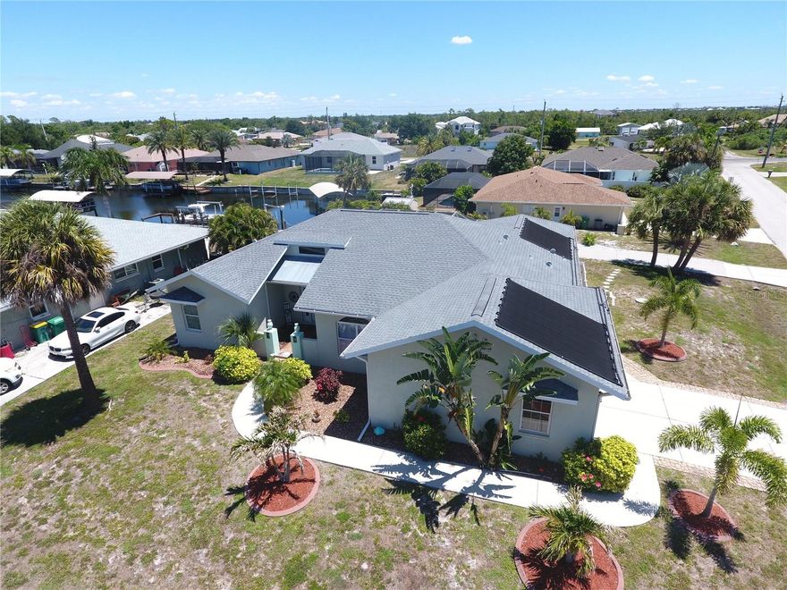 Beautiful saltwaterfront pool home with access to Charlotte Harbor and the Gulf! Built in 2006, this spacious 3 bedroom, 2 bath home offers 2,131 sq. ft. under air, an oversized 2-car garage, high ceilings, and an open floor plan designed for Florida living. French doors from the living area open to an expansive pool deck overlooking the solar-heated pool, dock, boat lift, and waterfront setting. The home has a separate Formal dining room (Could be used as an office) and a dinette area just off the kitchen with pool view.
The kitchen features abundant cabinet space with pull-outs and drawers, a cooktop, built-in oven, and a convenient built-in desk area.
The large primary suite includes a lighted coffered ceiling, two walk-in closets, and an en-suite bath with a tiled walk-in shower and soaking tub. The oversized interior laundry room also offers direct access to the primary bath.
The guest wing includes two spacious bedrooms, a well-appointed guest bath, and convenient pool access from the guest hallway and third bedroom. Additional features include a 2022 roof, oversized corner lot, and an impressive 81-foot extra parking pad—perfect for a boat, RV, or additional vehicles. A wonderful opportunity to enjoy boating, waterfront views, and the Southwest Florida lifestyle.