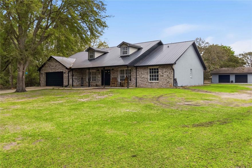 Bring the Farm Animals!! This stunning pool home sits on just over 2 acres in desirable Bay Lake Ranch with NO HOA, offering the perfect blend of space, privacy, and flexibility. The fully fenced property is shaded by beautiful oak trees and provides plenty of room for recreational vehicles, boats, RVs, and all of your animals. The property features multiple outbuildings, including: 36x24 detached garage with two roll-up doors 30x30 pole barn with electric 24x26 concrete carport Animal-ready and full of charm, you’ll also find horse stables featuring 5 stalls and an attached chicken coop complete with electric and water—perfect for horses, cows, goats, chickens, dogs, and more.  Step through the french doors into a newly updated and well-maintained home with an all NEW open-concept layout. The kitchen comes fully equipped with all new appliances and flows seamlessly into the living space. The spacious 24x13 primary suite offers: Walk-in closet with shelving, Dual sinks, Newly remodeled bathroom featuring a beautiful freestanding tub. The split floor plan provides privacy, with the second and third bedrooms located across the home, sharing a hall bath. The garage includes a 19x12 air-conditioned bonus room, ideal for a home office, gym, or flex space. Relax and unwind in your screened-in pool and enjoy the covered lanai with durable epoxy floors—perfect for year-round Florida living. Recent Updates Include: A/C (2017), Well (2018), Pool refinished & new equipment (2020), Whole-house water filtration system (2023), Fresh exterior painting (2025), NEW metal roof (2025). RV on site is optional with purchase.  Conveniently located: 20 miles to Lake Nona Medical City, 30 miles to Orlando, International Airport (OIA), 40 miles to Melbourne. This property truly has it all—space, upgrades, and a lifestyle you won’t want to miss. Call today to schedule your private showing!