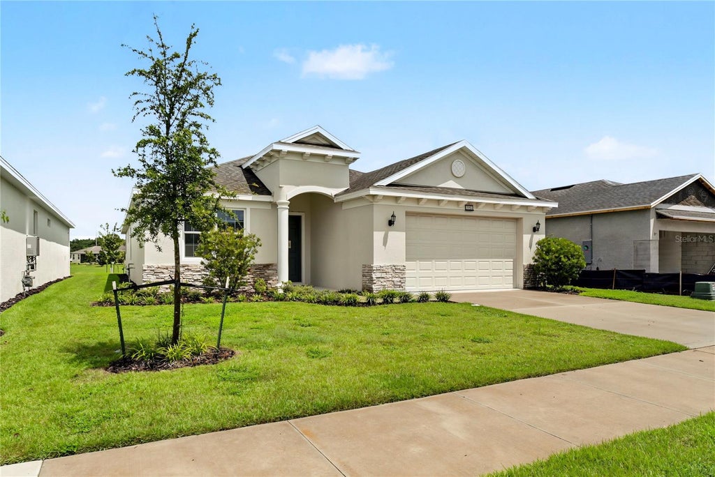 Photo of 3951 Kennebunk Loop, Mount Dora, FL 32757 (MLS # O6439079)