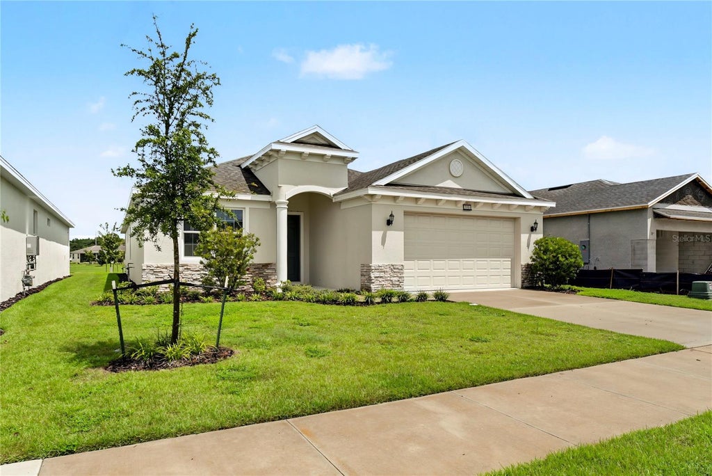 Photo of 3951 Kennebunk Loop, Mount Dora, FL 32757 (MLS # O6439079)