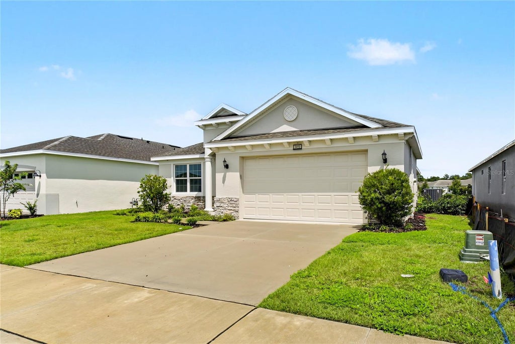 Photo of 3951 Kennebunk Loop, Mount Dora, FL 32757 (MLS # O6439079)