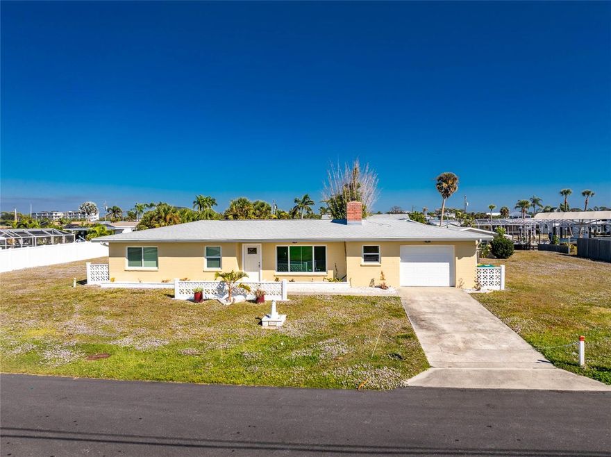 Location, location, location!  Delightful 3 Bedroom, 2 Bathroom one story WATERFRONT home with one car garage. This home has a 158 concrete seawall and your very own boathouse with lift. Direct access to Lemon Bay, the ICW and the Gulf of Mexico. This light and bright home is only 2 miles to gorgeous Englewood Beach, restaurants and shopping. This lovely home has a Great Room with wood burning fireplace (currently has an electric fireplace with remote) and large picture window. The kitchen offers white cabinetry, stainless appliances, tile backsplash. Appliances include double door refrigerator, oven/range, built in microwave, dishwasher. Tile floors throughout, one bathroom has a tub/shower combination - the other has a walk in shower. This is a great home in a wonderful community.