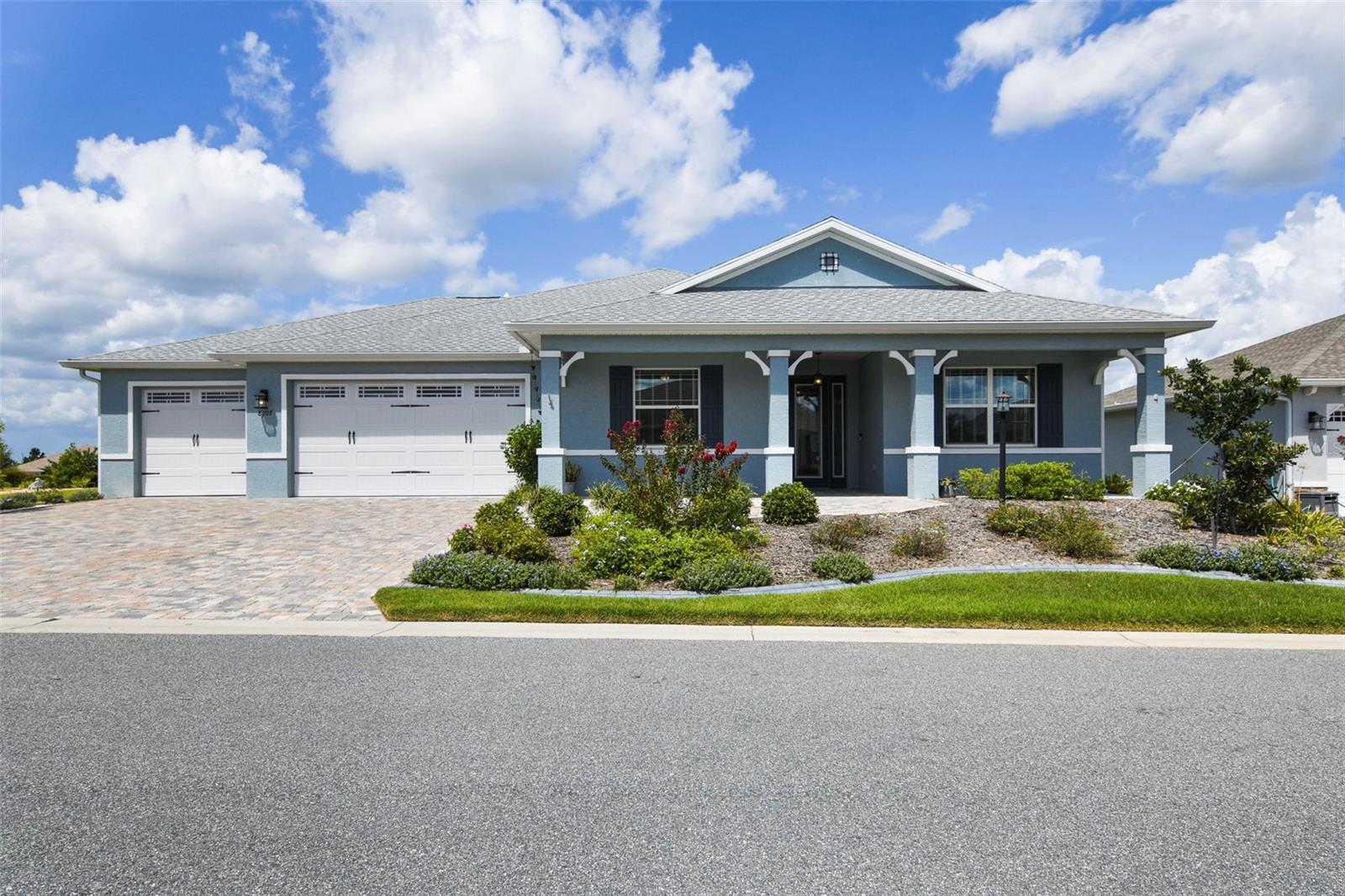 Welcome to this beautifully crafted 2021-built home, nestled within the premier 55+ community of On Top of the World—a neighborhood renowned for its vibrant lifestyle and unparalleled amenities. Designed with comfort in mind, this home features an impressive oversized three-car garage, offering abundant room for multiple vehicles, golf carts, bikes, and storage. As you step inside, you're immediately greeted by a bright and open floorplan bathed in natural light, with rich tile plank flooring stretching throughout the main living areas. The heart of the home is a gourmet kitchen, thoughtfully appointed with gleaming granite countertops, a stylish tile backsplash, stainless steel appliances, and a large central island—perfect for entertaining or casual meals. The split-bedroom layout offers privacy and flexibility, including a spacious in-law suite ideal for extended family or guests. A standout feature of this home is the versatile bonus room, currently used as a workshop but easily transformed into a private office, craft room, mancave, or climate-controlled storage. Large sliding glass doors connect the indoors to the outdoors, leading to a lushly landscaped backyard and a screened-in lanai where you can sip your morning coffee or unwind in the evenings, enjoying the serene Florida breezes. An exceptional bonus for qualified VA buyers: this home offers an assumable VA mortgage at a very low interest rate, providing a rare opportunity for significant long-term savings. Living in On Top of the World means access to a resort-style lifestyle, including multiple championship golf courses, state-of-the-art fitness centers, sparkling pools, full-service restaurants, scenic walking and biking trails, and countless recreational opportunities, from pickleball and tennis courts to over 175 resident-led clubs and activities. This home is more than move-in ready, it's a gateway to the lifestyle you've been dreaming of. Call and schedule an appointment today!