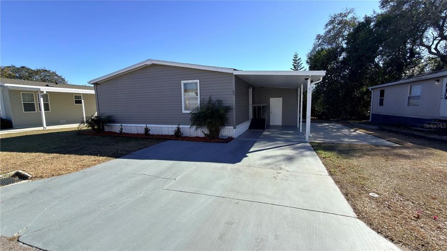 Well-maintained 3-bedroom, 2-bath manufactured home located in Orange Lake Mobile Home Park in Clermont. Approximately 1,456 sq ft on leased land. Major updates include a NEW ROOF (2023) and A/C system (2021). Monthly lot rent of $954 includes water, sewer, trash, and property taxes. Carport included. Security camera system included (some cameras currently disconnected but equipment conveys). Buyer must obtain park approval prior to closing. Title is clear and ready for transfer. Affordable living with recent upgrades already completed.