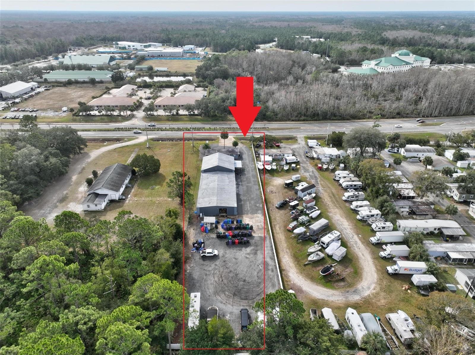 This spacious commercial warehouse in Bunnell, Florida, features 7,500 square feet of adaptable space and a 1,312 sq ft office right on State Road 100. Perfectly located for businesses seeking high visibility and easy access, it ensures a continuous flow of foot and vehicle traffic. Positioned on State Road 100, the property benefits from its prime location connecting to major highways, facilitating transportation and logistics operations. The property includes a 7,500 sq ft warehouse ideal for various business activities, whether it be storage, manufacturing, distribution, or retail. It is adaptable to meet your specific needs. Additionally, there’s a 1,312 sq ft office at the front of the property that the owners have updated completely with new paint, fixtures, drywall, flooring, kitchen, etc. It features easy loading facilities with large 12ft high bay doors and loading areas. There is plenty of parking space with a substantial lot for employees and clients at the front and rear. The warehouse's open floor plan allows flexibility for customization, aligning with your business's unique layout and requirements, whether for office partitioning or specialized equipment areas. This property is positioned well to capitalize on Bunnell's growing business environment. Bunnell provides a supportive community network and resources for businesses looking to thrive and expand. This commercial property is not only a functional space but also an investment opportunity with potential appreciation in value due to ongoing developments along State Road 100. Whether starting a new venture or expanding your current operations, this warehouse on State Road 100 that sits on over an acre of land is ready to prepare your business for growth. Sale of real property only. Business is not included!