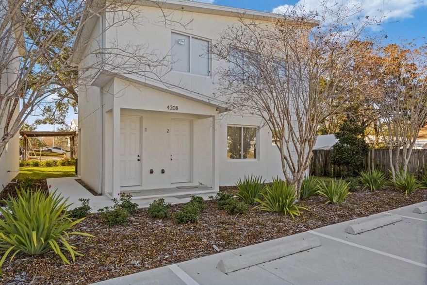 One or more photo(s) has been virtually staged. AVAILABLE MARCH 1ST. Completed in 2024, this thoughtfully designed 2-bedroom, 2-bath townhome offers comfortable, modern living in a convenient Tampa location. The open-concept layout, stainless steel appliances, and in-unit laundry room with stackable washer and dryer make everyday living feel easy and streamlined. The home includes two assigned parking spaces, along with a covered porch and private yard space — ideal for enjoying your morning coffee, unwinding after a long day, or spending time outdoors. Centrally located near Midtown, International Plaza, Raymond James Stadium, St. Joseph’s Hospital, Tampa International Airport, UT, and HCC, this home keeps you close to everything.