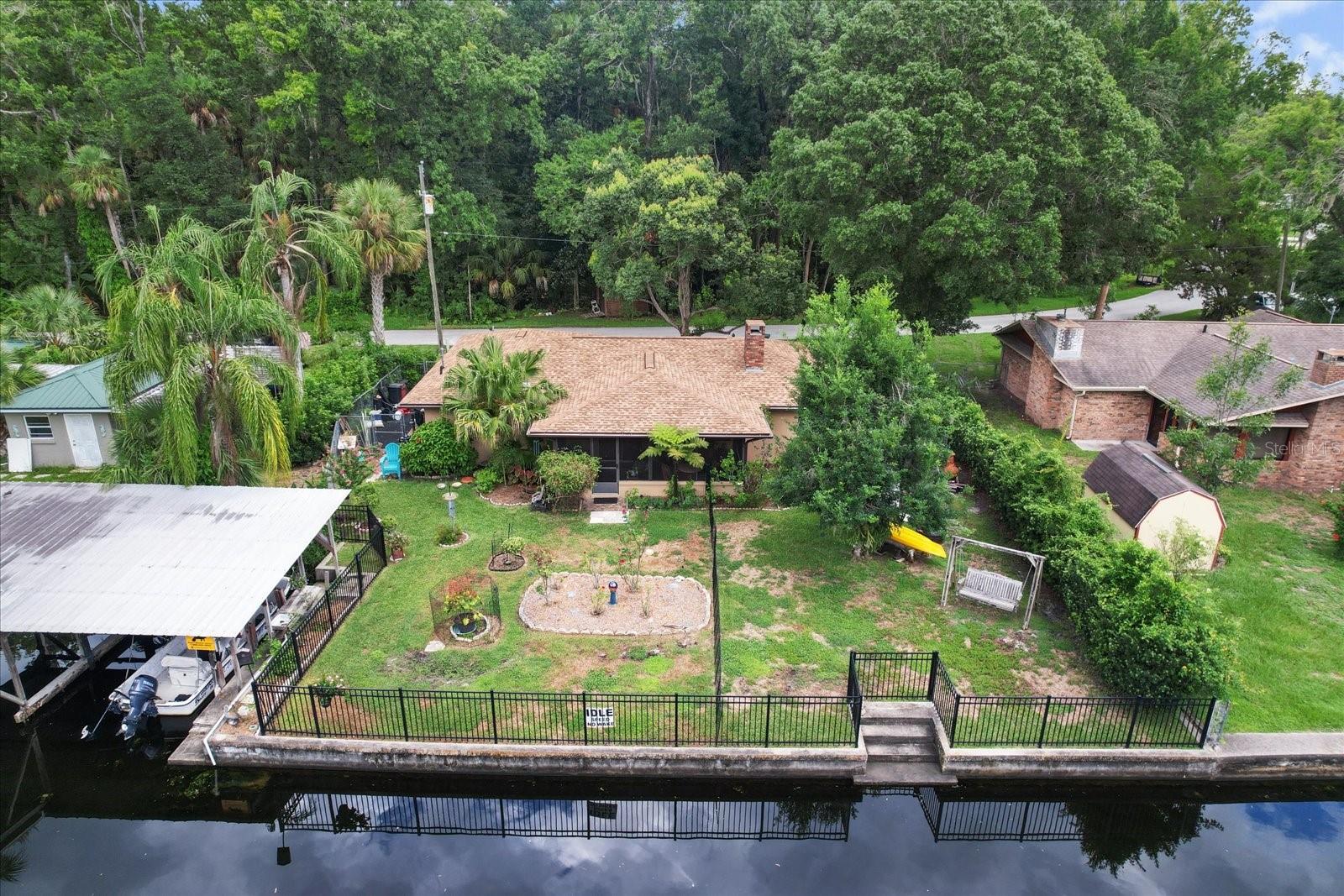 Nature lovers - if you enjoy peace and tranquility, this is it! This unique waterfront home sits near the end of the main spring-fed canal (Brittle canal), with direct access to the Chassahowitzka River and Gulf of America. (No bridges!) Come discover the good life! Just a quick paddle away from the pristine head springs of the Chassahowitzka River and Seven Sisters Springs. This 2 bedroom, 2 bath home is a great weekender or fisherman’s full-time oasis. Open concept layout with new flooring, new refrigerator, dishwasher & dryer, wood burning fireplace, Roof 2022, Hot Water Heater 2023, fully fenced, storage shed, & much more! Relax on the screened porch & watch for otter, bottle-nose dolphin, manatees, and turtles that frequent the clear spring-fed canal. Concrete steps lead down to the waterway, making canoe/kayak launch a breeze. Enjoy the convenience of the public boat ramp nearby and your own covered boat slip right in your backyard. The Chassahowitzka River snakes to the Gulf and is surrounded by the National Wildlife Preserve. This home is a MUST-SEE to truly appreciate!