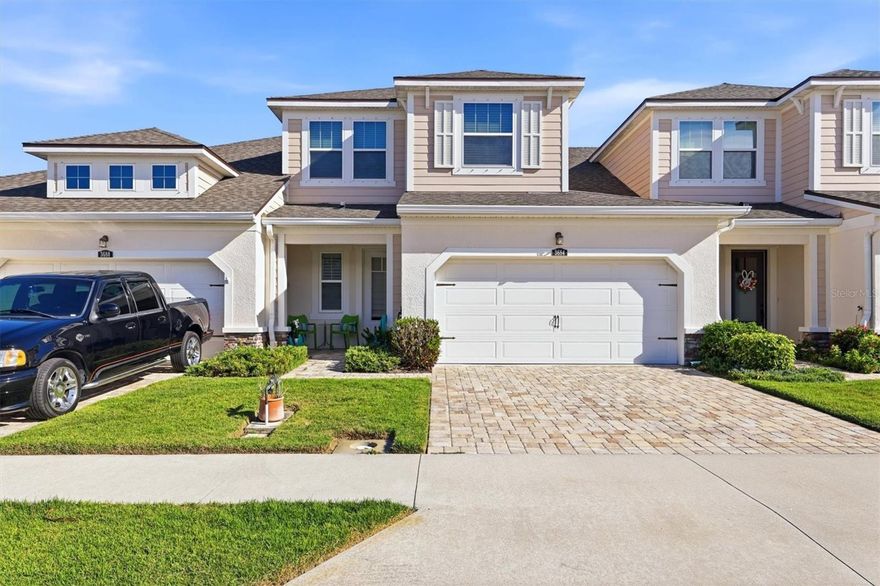 Location truly is everything—and this exceptional townhome in Enclave at Forest Lakes delivers.  Ideally situated in the heart of Sarasota, this gated community offers unmatched convenience with two public golf courses nearby, direct access to the Legacy Trail just beyond the Webber Street gate, and seamless connectivity in every direction—north, south, east, and west. Inside the community, residents enjoy a welcoming gathering area, resort-style pool, and dog park—perfect for both relaxation and an active lifestyle.  Built in 2018, this residence stands out as one of Mattamy’s finest offerings, showcasing a range of thoughtful upgrades and refined finishes throughout. Engineered hardwood flooring adds warmth and durability underfoot, while the French Country–inspired kitchen features rich cabinetry with bronze accents, elegant granite countertops, a stacked stone backsplash, wall-mounted oven and microwave, and a sleek electric cooktop.  Designed for both everyday living and entertaining, the open layout includes a breakfast bar with seating for three, a spacious dining area accommodating up to six, and a comfortable living room that opens through sliding glass doors to a fully covered lanai—ideal for year-round enjoyment. Architectural details such as solid wood and wrought iron stair railings add character and sophistication. Upstairs, a versatile loft and additional flex space provide endless possibilities—whether used as a media room, home office, fitness area, or creative studio. Two generously sized bedrooms offer comfort and privacy, complemented by a well-appointed bathroom with granite countertops, French Country cabinetry, and a tub/shower combination. The primary suite, conveniently located on the main floor, is a true retreat featuring crown molding, a spacious dual-sink vanity with extended granite countertop, and an oversized walk-in closet with ample dressing space.  In the garage is a new whole-house water purifying system by WaterExpress. This is more than just a home—it’s a lifestyle. Discover the comfort, quality, and convenience waiting for you at Enclave at Forest Lakes.