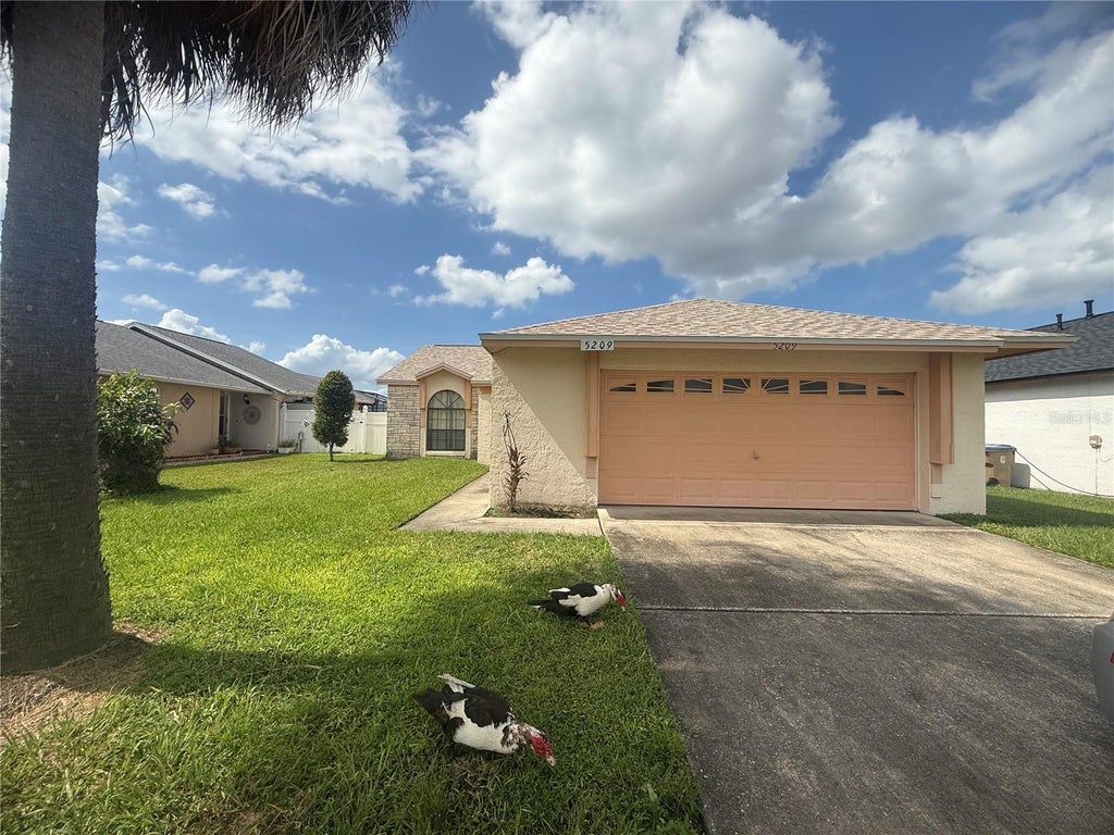 Photo of 5209 Broken Arrow Drive, Kissimmee, FL 34746 (MLS # S5157537)