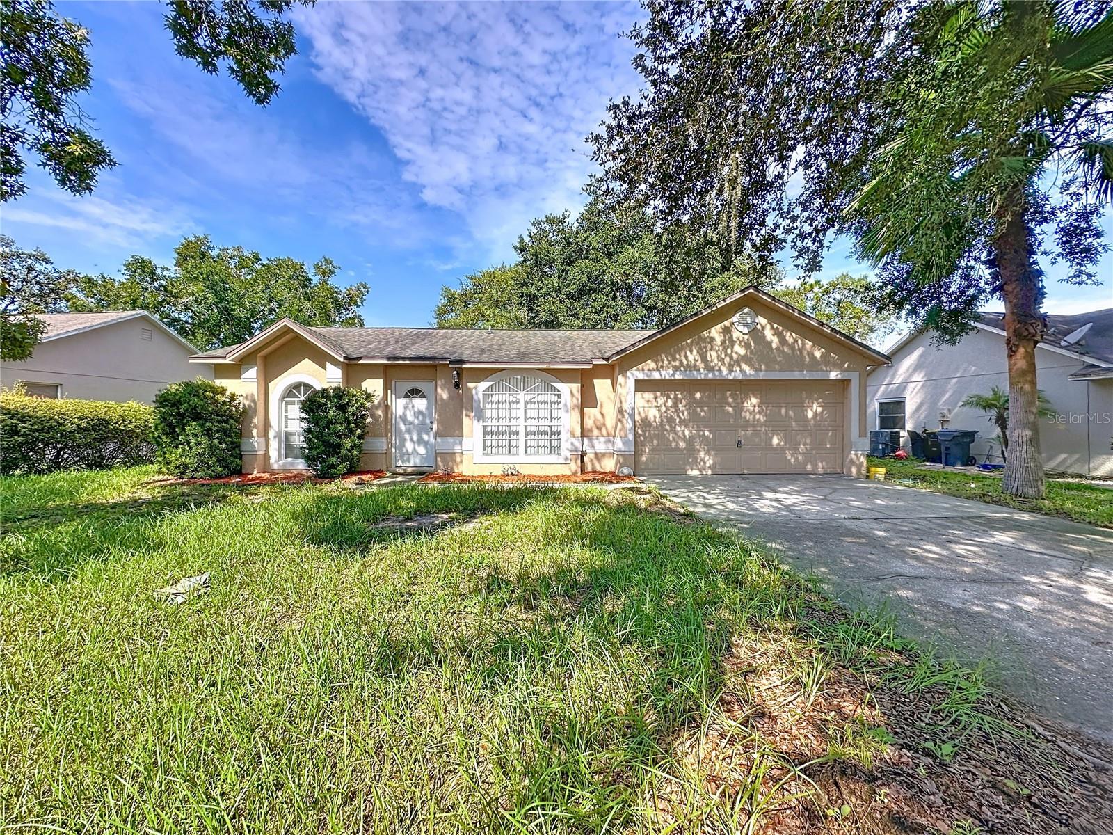 Welcome to 215 Foggy Creek Road, a delightful property in the sought-after community of Sunridge Woods where the annual HOA is just $195. This charming home offers wonderful potential as a long-term investment, short-term rental, or permanent residence. Inside you’ll find three bedrooms and two bathrooms, along with a spacious open-plan living and dining room that flows seamlessly into the kitchen and breakfast area—an ideal layout to enjoy and make your own. Recent updates including new flooring and fresh paint add to the appeal and provide a fresh canvas for its next owner.
Step outside to a large screened deck featuring a private swimming pool and spa, perfectly designed for year-round Florida living. A covered lanai creates a comfortable space for entertaining, while the generous backyard with mature landscaping offers room to spread out. Fences are permitted, making this a great option for families and pets.
Additional highlights include a wide driveway and two-car garage for ample parking. The location is just minutes from dining, shopping, and medical facilities in ChampionsGate, with easy access to I-4, toll roads, and Orlando International Airport. Sunridge Woods is a quiet, established neighborhood where low annual fees combine with convenience and charm, making this home an exceptional choice for value, location, and lifestyle.