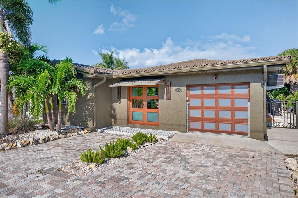 Photo of 234 145th Avenue E, Madeira Beach, FL 33708 (MLS # TB8440234)