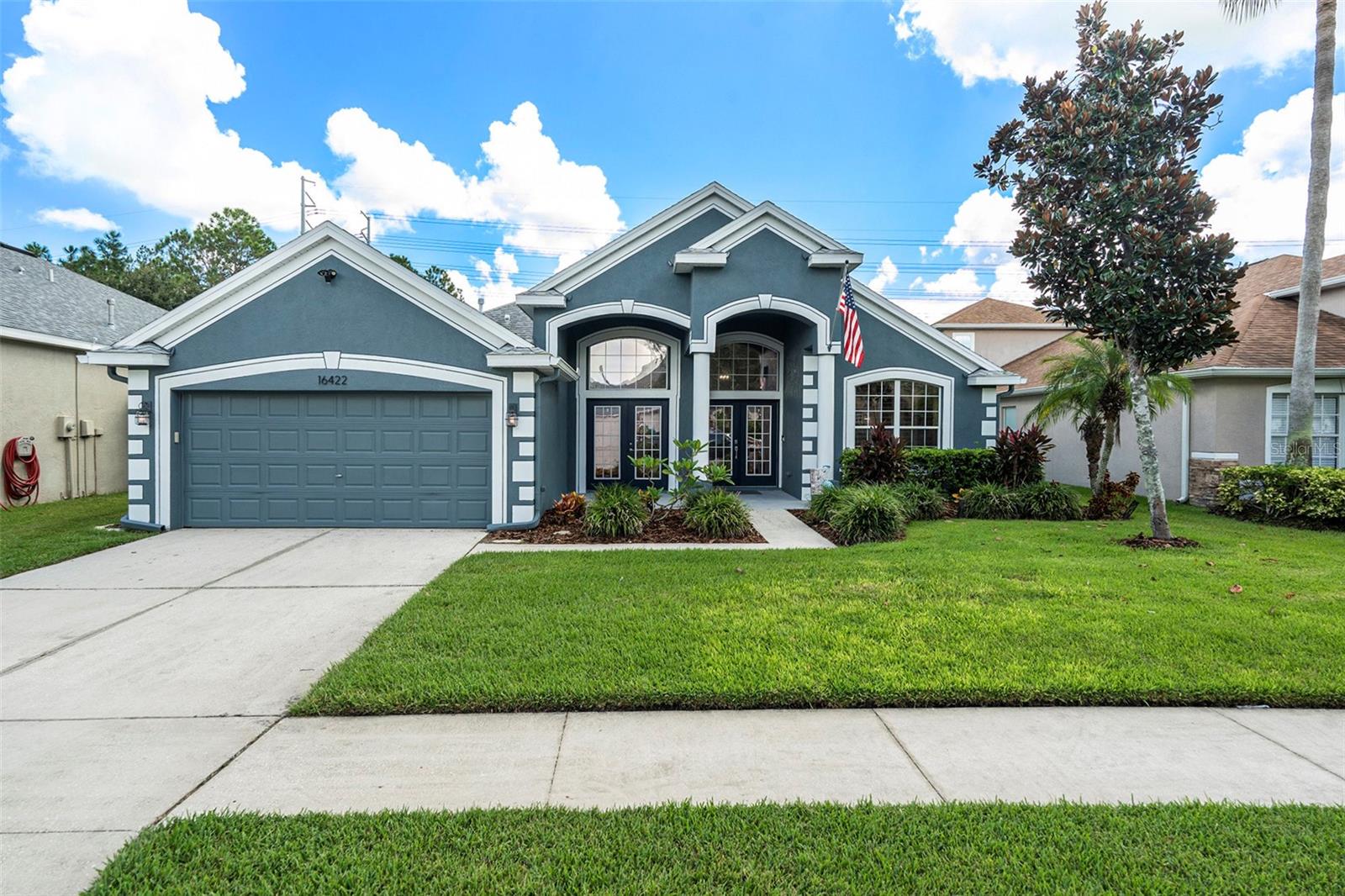 This beautifully updated 5-bedroom, 2.5-bath home is all about comfort, style, and fun. With an open-concept design, there’s plenty of room to gather, entertain, or simply relax. The primary suite is a true escape with a spa-inspired bathroom featuring a standalone soaking tub, walk-in shower, and a roomy walk-in closet. The home’s bedrooms are set up in a three-way split plan; the primary is tucked off the kitchen for privacy, while three downstairs bedrooms sit off the family room (one currently used as a home gym). Upstairs, a fifth bedroom with a half bath makes the perfect guest retreat or private office. The kitchen is the heart of this home, and it doesn’t disappoint. You’ll find solid wood shaker cabinets with brushed gold accents and soft-close hinges, quartzite counters, a farmhouse sink, sleek black stainless steel appliances, a wine fridge and bar area, plus a walk-in pantry. The gas stove makes cooking easy, while the eat-in kitchen flows into the large family room. Just off the entry, the living room and dining room welcome guests with natural light and stylish shutters. Step outside and the fun continues with a covered, screened-in patio and an in-ground saltwater pool. Beyond the fenced yard, a cozy fire pit overlooks the pond and connects you to more than 30 miles of scenic FishHawk Ranch trails for walking, jogging, or biking. Updates bring peace of mind with pool equipment replaced in 2020, a tankless gas water heater replaced in 2021, a new roof in 2020, and an A/C system replaced in 2018. Inside, you’ll love the luxury vinyl plank flooring throughout the common areas and all downstairs bedrooms, updated tile in the bathrooms and laundry room, and brand-new carpet upstairs. Gas or electric washer/dryer hook-ups add even more convenience. Living in FishHawk Ranch means enjoying resort-style amenities, multiple clubhouses, pools, splash parks, playgrounds, skate parks, tennis and basketball courts, fitness centers, and over 30 miles of trails. Add in the top A-rated schools and you’ve got one of Tampa Bay’s most desirable communities. This home blends modern upgrades, thoughtful design, and a lifestyle that’s as active or relaxing as you want it to be.