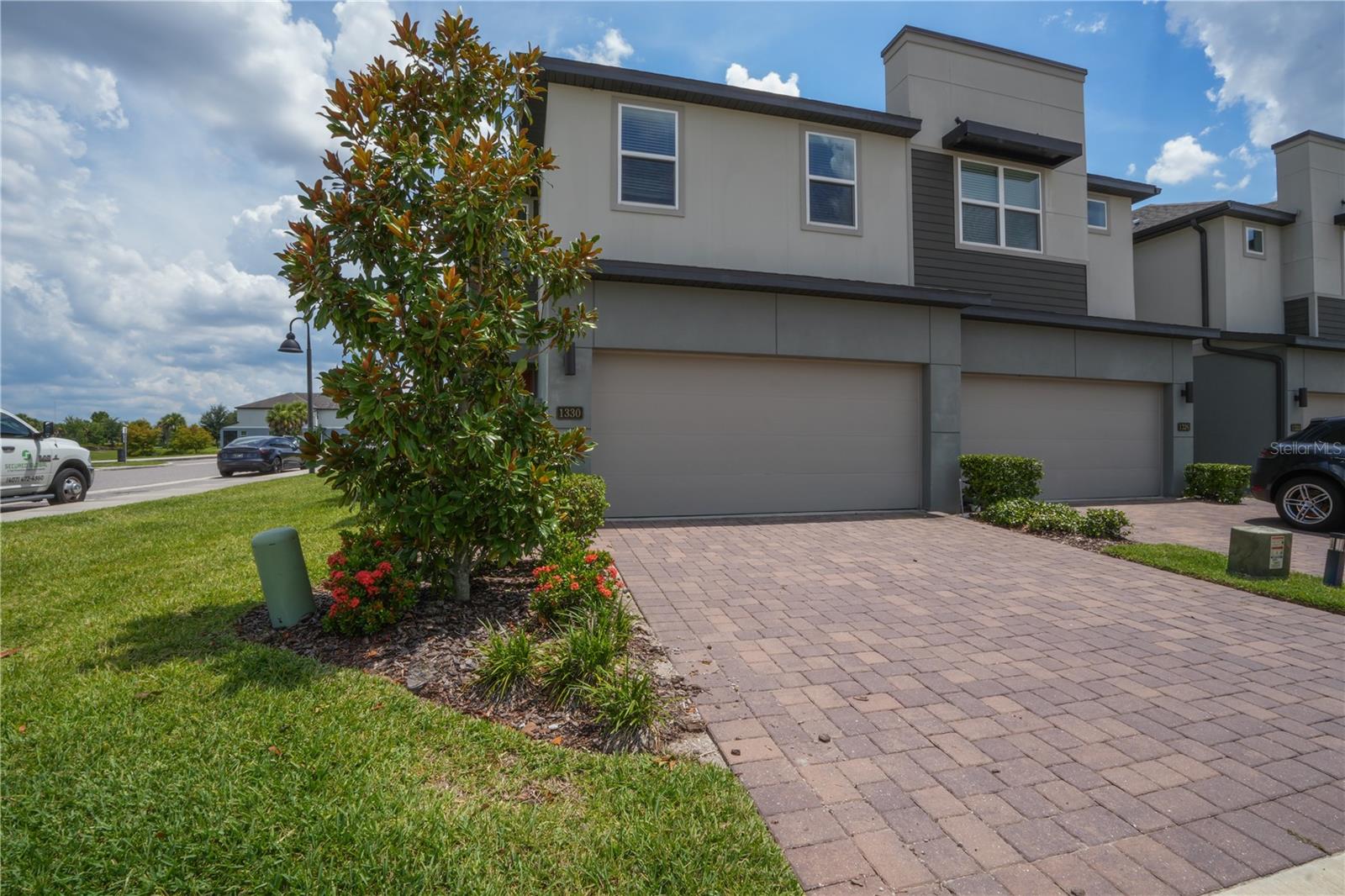 Welcome to Enclave at Hawks Crest! This corner-unit 3-bedroom, 2.5-bath townhome offers added privacy, extra natural light, and peaceful pond views, all in one of Winter Park’s most desirable gated communities. Built in 2021, this thoughtfully upgraded home features a custom wood-accent TV wall with LED lighting and floating console, plus a beautifully designed kitchen island with matching wood paneling that enhances the open living space.
The first floor showcases Luxury Vinyl Plank flooring throughout, offering the elegance of hardwood with superior durability and easy maintenance. The main living area flows seamlessly into a modern kitchen with quartz countertops, stainless steel appliances, shaker cabinetry, and a large island perfect for entertaining. Side-facing windows in the living room provide serene views of a tranquil pond, creating a bright and relaxing atmosphere.
Upstairs, the primary suite also enjoys pond views from its side windows and features tray ceilings, a spa-like suite with dual quartz vanities, a walk-in shower, and spacious walk-in closet. A large loft provides flexible space for a media room, office, or playroom. Two additional bedrooms, each with walk-in closets share a full bathroom. The upstairs laundry room includes washer and dryer for added convenience.
A private back porch offers space to relax outdoors, while the corner location means no direct neighbor on one side, a rare and valuable feature. Hawks Crest offers resort-style amenities including a sparkling pool, playground, parks, and picnic areas. Low HOA fees cover cable, internet, roof and exterior maintenance, landscaping, gated access, and more.
Ideally located just steps from Park Maitland Preschool and minutes from Trinity Prep, with quick access to boutique shops, top dining spots like Foxtail Coffee and The Ravenous Pig, and charming downtown Winter Park. Don’t miss the chance to own this upgraded, move-in-ready corner unit with pond views in one of Central Florida’s most sought-after communities. Schedule your private tour today!