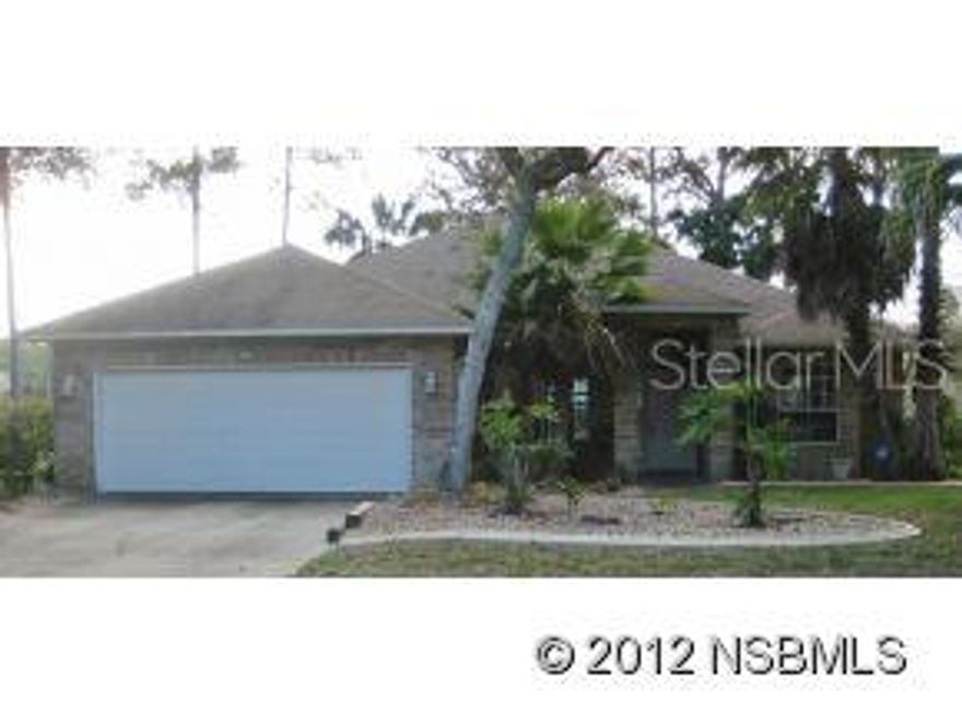 **BREAKAWAY TRAILS LAKEFRONT BRICK HOME** Tranquil lake views can be enjoyed from the spacious living/dining room areas, family room, kitchen, breakfast nook, master bedroom & Florida room. 24 foot long master bedroom can easily accommodate a king size bedroom suite & sitting/office area and has a door leading to the Florida room. Master bathroom features garden tub, walk-in shower, 2 separate sink/cabinet areas, separate room for commode, beautiful window for lots of natural light & master closet. 28 foot long kitchen offers a breakfast bar & nook and door to Florida room. Easy care, fully tiled floors through out. Crown molding. Volume ceilings. Landscaping beds have concrete curbing. Florida room is under heat & air. Inside laundry room. Security system (not armed) GATED COMMUNITY with two 24-hour a day manned guardhouses. $258 per quarter HOA fee ($86 per month) covers: community pool, tennis, playground, 2 manned security gates, signage, HOA administrative fees, common area maintenance including retention ponds & fountains. No survey on file. Lot dimensions given are from a previous MLS listing of this property. Convenient to shopping, restaurants, houses of worship, medical facilities, golf courses, parks, major highways, airports and more! About 1-1/2 hours to Orlando. Only about 8 miles and 18 minutes to the World�s Most Famous Beach! This is your chance to own an affordable home in the Florida sunshine! ;Water: City