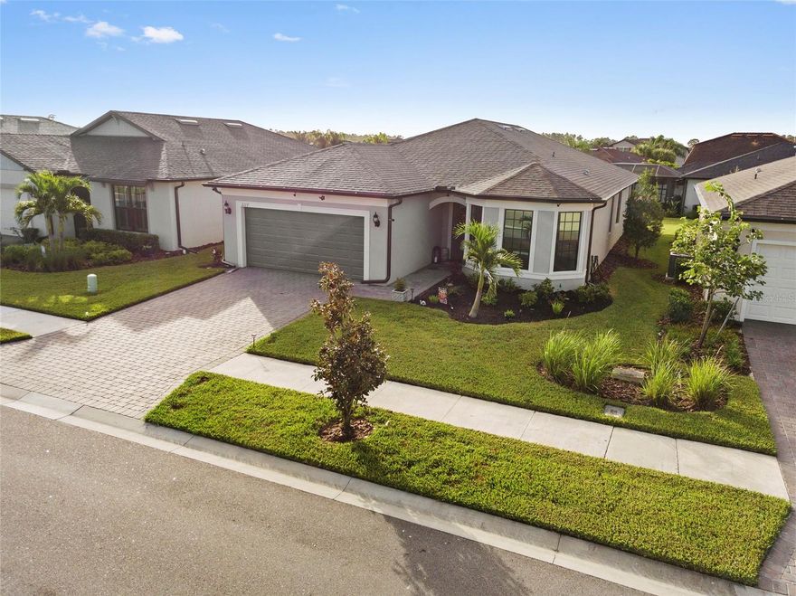 WELCOME TO THIS BEAUTIFUL 2-YEAR-OLD HOME! This 3-bedroom plus den, 2-bath home is located in the desirable community of Cedar Grove at the Woodlands, which offers a community pool and playground just minutes from the Gulf beaches. Enjoy great curb appeal with upgraded landscaping that sets the tone for what’s inside.

Enter through the hurricane-rated etched glass door and find 8-foot doors, hurricane-impact windows, and custom window treatments throughout. The open floor plan is perfect for entertaining and everyday living, featuring high-quality ceiling fans and plenty of natural light.

The kitchen offers quartz countertops, a large island, tile backsplash, 42" upper cabinets, and an upgraded appliance package. The guest bedrooms and den share a stylish bathroom with quartz countertops and a tall vanity.

The primary suite overlooks the pond and includes a walk-in shower with floor-to-ceiling tile, dual vanities with quartz countertops, and a large walk-in closet.

Additional features include a laundry room with cabinets and sink, an extended 4-foot garage with overhead storage racks, and a covered lanai for relaxing outdoors.

BONUS: Termite warranty transfers to Buyer for a $149 fee. Sellers are also including a 1-year American Home Shield warranty and the remaining builder’s warranty for peace of mind.