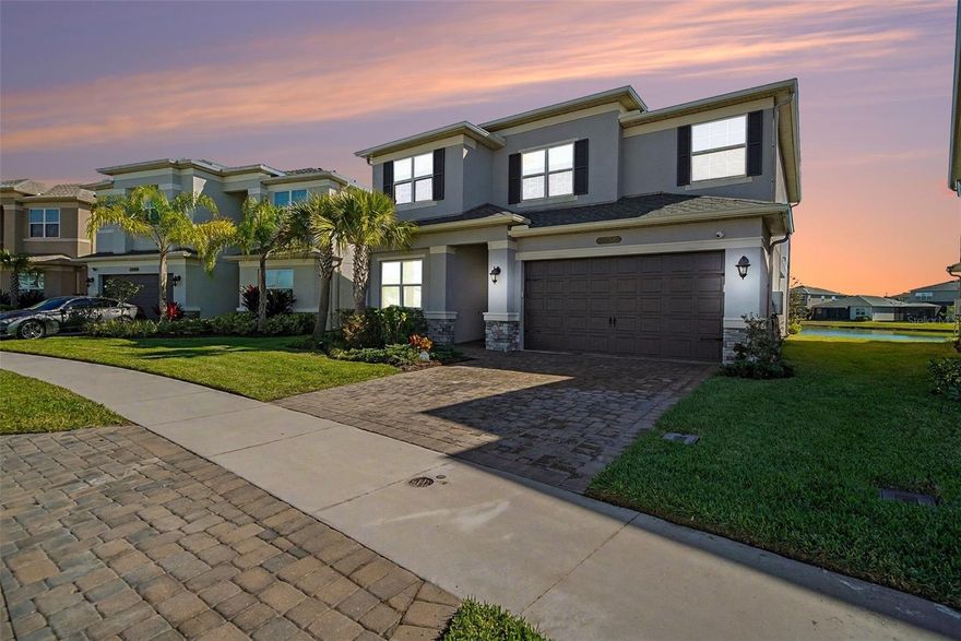Welcome to Winding Ridge in Wesley Chapel! This beautiful GL Homes Alexia floor plan offers 5 bedrooms, 4 bathrooms, and a 2-car garage on a one-of-a-kind pond-view homesite. Enjoy true Florida indoor/outdoor living from the screened panoramic lanai, where tranquil water views set the scene for morning coffee and unforgettable sunsets. A first-floor guest bedroom and full bathroom offer ideal flexibility for visitors or multigenerational living. Upstairs, you’ll find an oversized bonus room, a convenient laundry room, and the remaining bedrooms. Inside, the home shines with a fully upgraded kitchen featuring an oversized island, tall cabinetry, and a highly functional layout designed for entertaining and everyday life. Thoughtful upgrades throughout add comfort and functionality. Winding Ridge is a gated community with resort-style amenities, including a clubhouse, state-of-the-art fitness center, resort-style pool and cabana, tennis, pickleball, basketball, playground, and a splash pad/water play area. Conveniently located near shopping, dining, and major highways—schedule your private showing today and experience the lifestyle this home and community deliver!