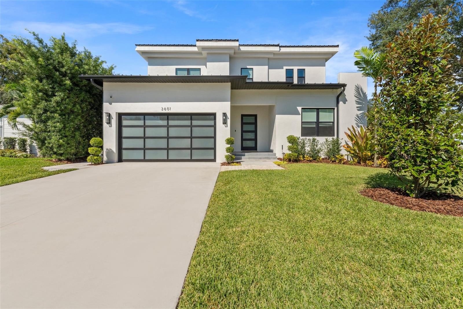Stunning 2025 built luxury pool home offering modern design, high-end finishes, and an ideal South Tampa location. X flood zone (no flood insurance required), and A-rated Mitchell/Wilson/Plant school zone! 5 bedrooms/ 3.5 bathroom/ 3625 heated sqft. Sellers recently installed a contemporary garage door to enhance curb appeal.The open-concept layout is perfect for everyday living and entertaining, featuring a gourmet kitchen with stone countertops, premium appliances, large island, and walk-in pantry. The spacious first floor includes a guest suite or optional primary, home office, and generous storage. Upstairs, the luxe primary suite features a spa-like bath and walk-in closet with custom built-ins. Three more bedrooms and a loft are upstairs. Enjoy seamless indoor-outdoor living with a private backyard oasis, complete with a heated pool/spa, covered lanai, and lush landscaping. Additional upgrades include hardwood flooring, impact-rated windows/doors, and tankless water heater. Just minutes to top schools, Hyde Park, Midtown, Downtown Tampa, TPA Airport, shopping, dining, and beaches.