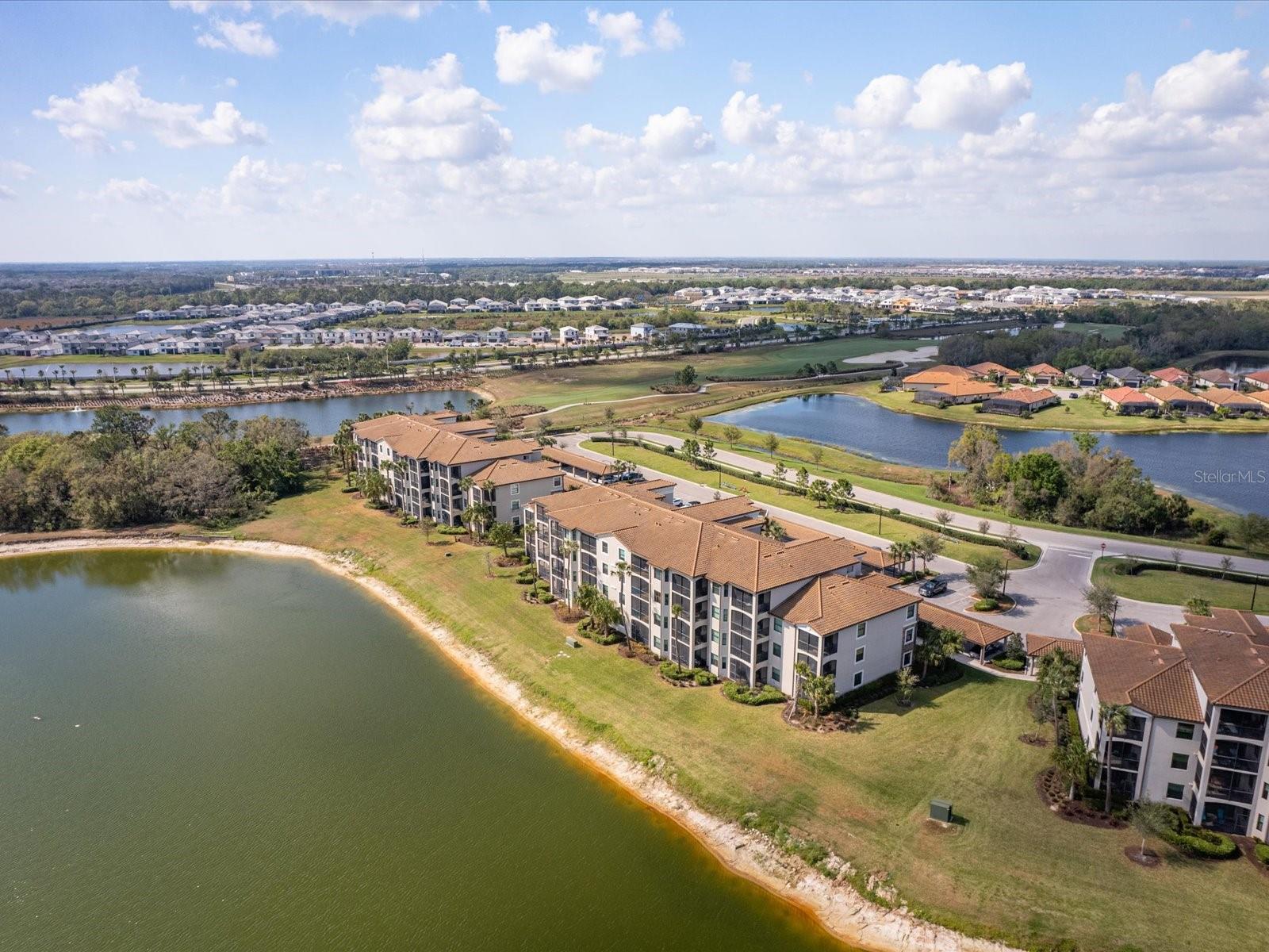 Turnkey Furnished Short-Term Rental Available Beginning July 1st 2025. Designer decorated just bring your toothbrush and your golf clubs - South facing condo featuring an oversized lanai with views of the lake and golf course. Open floorplan with bar seating and eat in kitchen. Flex space available for office/den. Granite countertops, Stainless Steel appliances and wood cabinets make the kitchen a centerpiece of the home. Crown molding throughout, primary bedroom has 2 closets with one large walk in and large bathroom. There is a storage closet outside the front door for beach chairs, bikes and golf and tennis equipment. The resort-style Golf and Country Club has a beach-entry lagoon pool and a spa, poolside dining and a tiki bar. The state-of-the-art fitness center, with yoga and spin studios are open 24 hours, 7 days a week. The rent includes a full club membership with unlimited golfing on two PGA designed 18 hole Arnold Palmer courses, 8 har-tru clay tennis courts, and four pickle ball courts. Lakewood Ranch has amazing shopping, dining, arts, entertainment, nature and recreational opportunities. Only Minutes from Nathan Benderson Park with world class rowing events, premier sports fields and world class beaches. Convenient to shopping, restaurants, entertainment, and UTC Mall. Easy access to I-75, Sarasota Airport, Tampa International Airport, and Tampa/St. Petersburg.
