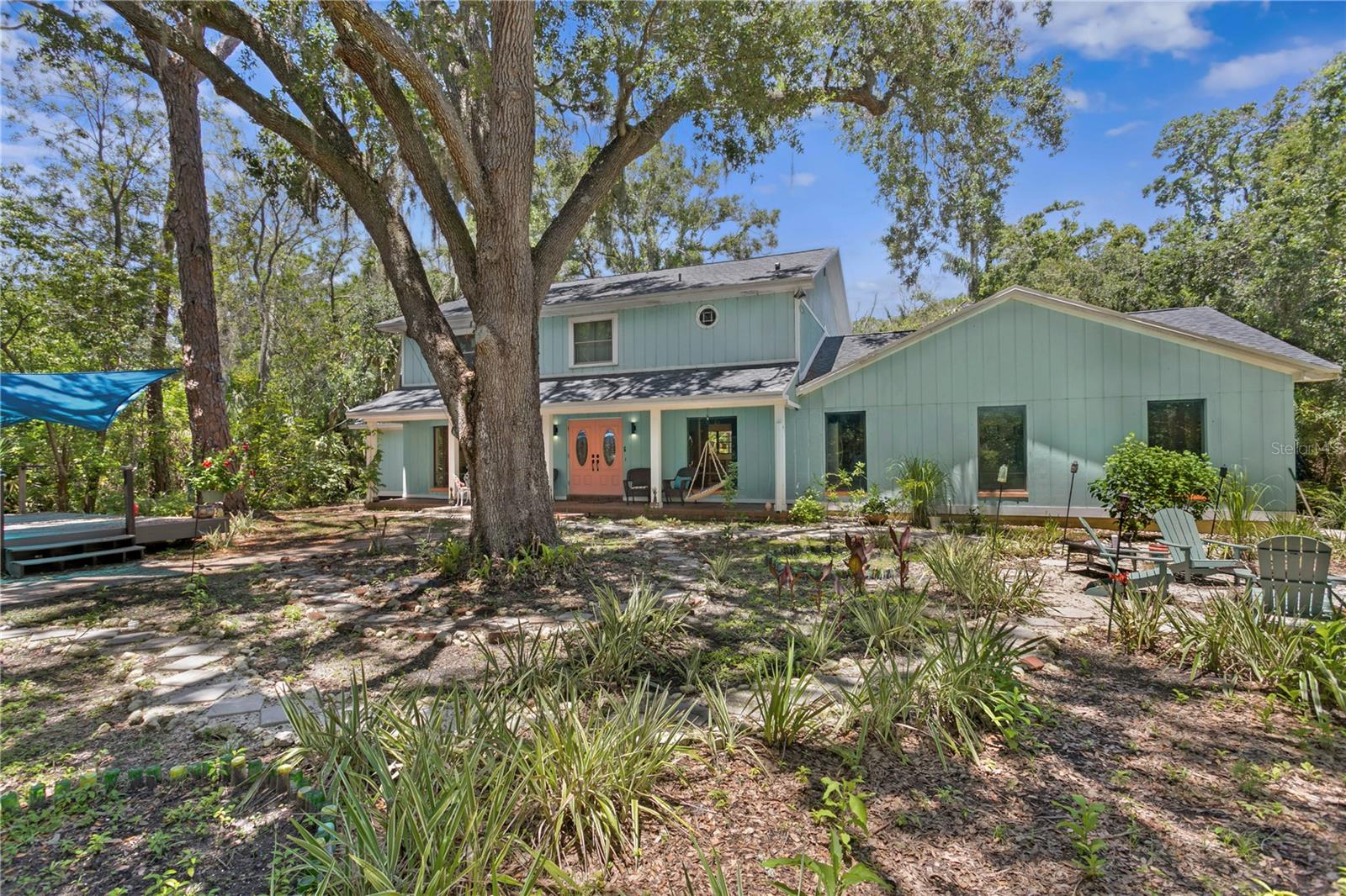 Serenity Meets Style in the Heart of North Dunedin
This magnificent two-story home, beautifully updated and fully remodeled, is tucked beside the natural beauty of Hammock Park on nearly an acre of peaceful, private land. Located in one of Dunedin’s most desirable areas, you're just steps from the world-famous Pinellas Trail and Honeymoon Island, and close to downtown, the Dunedin Community, Art and Nature Centers, parks, playgrounds, tennis courts, and more.
Inside, no detail was overlooked. Nearly everything is new—floors, countertops, cabinets, appliances, roof, and AC. The open and spacious layout of this 5 bedroom, 3 and a half bath home offers both comfort and flexibility, whether you’re relaxing by the cozy fireplace or enjoying the large pool in your private backyard retreat.
A rare blend of location, luxury, and tranquility—this is the Dunedin home you’ve been waiting for.