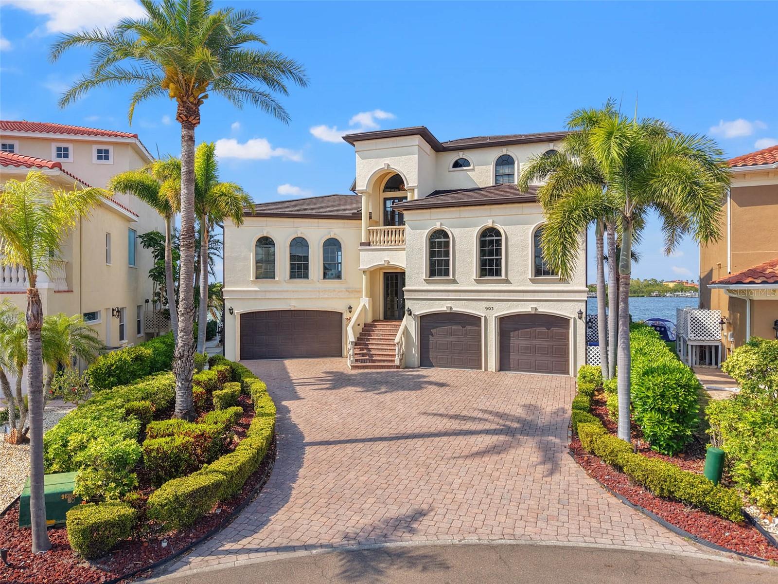 One or more photo(s) has been virtually staged. Stunning Waterfront Home with Breathtaking Open Water Views!
Nestled within the exclusive, gated community of Symphony Isles, this residence offers unparalleled luxury coastal living, blending elegance with modern convenience. From the moment you enter, the home captures the essence of waterfront living, with expansive views and sophisticated design.
The first floor features two versatile flex rooms, two 2-car garages, a full bath and a guest room — ideal for visitors or a private retreat. The second floor is designed for both relaxation and entertainment, with an oversized family room complete with a wet bar and panoramic waterfront views. The space extends to a covered balcony, perfect for enjoying the scenery. The expansive kitchen is a chef's dream, outfitted with stainless steel built-in appliances. At the heart of the kitchen is an oversized island, ideal for meal prep, casual dining, or hosting guests. Custom cabinetry and granite countertops combine style with functionality, while the spacious layout provides ample room for culinary endeavors. Adjacent to the kitchen is the formal dining room, bathed in natural light from oversized windows.
There’s plenty of space for guests, with two generously sized guest rooms, each featuring an ensuite bathroom. The third floor is dedicated to the owner's retreat, complete with a spacious informal den, a private balcony, and a spa-like bathroom. Twin vanities, water closets, and walk-in closets with custom built-in systems enhance the suite’s luxury. The bathroom includes an enormous shower and a spa-like tub, creating a serene, relaxing space.
Throughout the home, you'll find elegant travertine and wood floors, and an elevator offering easy access to all levels. Outside, your private outdoor oasis awaits. Unwind by the recently updated pool (2020), or take in the stunning views from the newly constructed dock. The private marina features a boat slip and the option for a 10k boat lift — perfect for your next boating adventure.
Inside, thoughtful updates abound, including a roof replacement in 2019, newer AC system, water heaters, and a freshly repainted interior.
Located in the highly desirable Symphony Isles community, this home offers privacy, security, and convenience, while being just minutes from Downtown Tampa, Tampa International Airport, fine dining, and major sporting events. Don’t miss the chance to make this exceptional waterfront property yours!