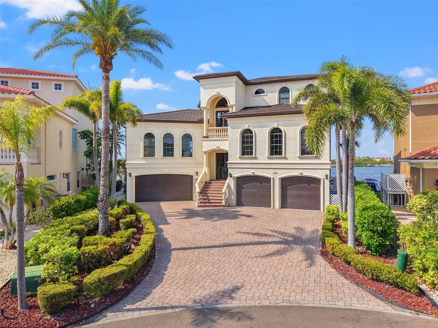 One or more photo(s) has been virtually staged. Stunning Waterfront Home with Breathtaking Open Water Views!

Nestled within the exclusive, gated community of Symphony Isles, this residence offers unparalleled luxury coastal living, blending elegance with modern convenience. From the moment you enter, the home captures the essence of waterfront living, with expansive views and sophisticated design.

The first floor features two versatile flex rooms, two 2-car garages, a full bath and a guest room — ideal for visitors or a private retreat. The second floor is designed for both relaxation and entertainment, with an oversized family room complete with a wet bar and panoramic waterfront views. The space extends to a covered balcony, perfect for enjoying the scenery. The expansive kitchen is a chef's dream, outfitted with stainless steel built-in appliances. At the heart of the kitchen is an oversized island, ideal for meal prep, casual dining, or hosting guests. Custom cabinetry and granite countertops combine style with functionality, while the spacious layout provides ample room for culinary endeavors. Adjacent to the kitchen is the formal dining room, bathed in natural light from oversized windows.

There’s plenty of space for guests, with two generously sized guest rooms, each featuring an ensuite bathroom. The third floor is dedicated to the owner's retreat, complete with a spacious informal den, a private balcony, and a spa-like bathroom. Twin vanities, water closets, and walk-in closets with custom built-in systems enhance the suite’s luxury. The bathroom includes an enormous shower and a spa-like tub, creating a serene, relaxing space.

Throughout the home, you'll find elegant travertine and wood floors, and an elevator offering easy access to all levels. Outside, your private outdoor oasis awaits. Unwind by the recently updated pool (2020), or take in the stunning views from the newly constructed dock. The private marina features a boat slip and the option for a 10k boat lift — perfect for your next boating adventure.

Inside, thoughtful updates abound, including a roof replacement in 2019, newer AC system, water heaters, and a freshly repainted interior.

Located in the highly desirable Symphony Isles community, this home offers privacy, security, and convenience, while being just minutes from Downtown Tampa, Tampa International Airport, fine dining, and major sporting events. Don’t miss the chance to make this exceptional waterfront property yours!