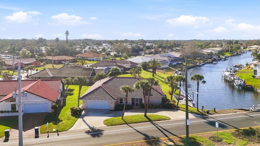 Welcome to this stunning turnkey furnished waterfront pool home located in the desirable Englewood Isles. This 3-bedroom, 2-bathroom residence offers a perfect blend of comfort and luxury with quick access to Lemon Bay and the Gulf, making it a boater's paradise. Step outside to the large lanai, where you'll find a sparkling pool with a spa, perfect for relaxing while enjoying breathtaking water views. The home features a composite dock, ideal for docking your boat, and a convenient outdoor shower. Inside, the split bedroom floor plan provides privacy and convenience, while the spacious master suite boasts dual closets and sliders leading directly to the lanai. The master bath includes a walk-in tile shower and dual sinks. The open kitchen is a chef’s dream, with a breakfast nook, closet pantry, and plenty of counter space for meal prep. The light-filled living areas feature pocket sliders that seamlessly connect the indoors to the outdoor living space. The third bedroom is generously sized, with its own set of sliders to the pool area, making it an ideal Florida room or guest retreat. Additional features include an inside laundry room, a screened front entry, and hurricane shutters for peace of mind. The 2022 roof ensures years of worry-free living. This home is just minutes from pristine beaches, fantastic restaurants, world-class fishing, golfing, and shopping. Don’t miss the opportunity to own this exceptional waterfront property!