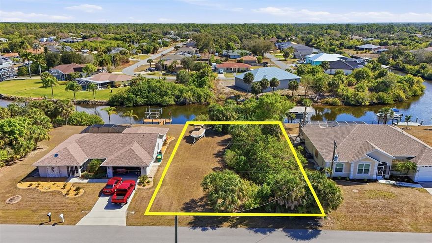 Build your Florida dream home on this standard-sized WATERFRONT LOT in the desirable community of Port Charlotte. Situated along a scenic canal, this property offers peaceful water views and the ideal setting for enjoying the laid-back coastal lifestyle. Need a builder? Let us introduce you to local reputable builders. Only 3.5 miles to the Edgewater Public boat ramp, 4 miles to the William R Gains Recreation park and close to US-41 & Port Charlotte Beach park. Port Charlotte beach park offers sand, sheltered waters, and spectacular sunsets year round. Amenities include a boardwalk with fishing pier, boat ramp, canoe/kayak launch, horseshoe pits, bocce courts, basketball courts, tennis courts, volleyball court, playground area, small shelters with a picnic tables, two large pavilions, and restrooms. Also just a short car ride to the Gulf Beaches of Boca Grande, Englewood, or Manasota Key to name a few where you will find world class fishing and white sand between your toes.