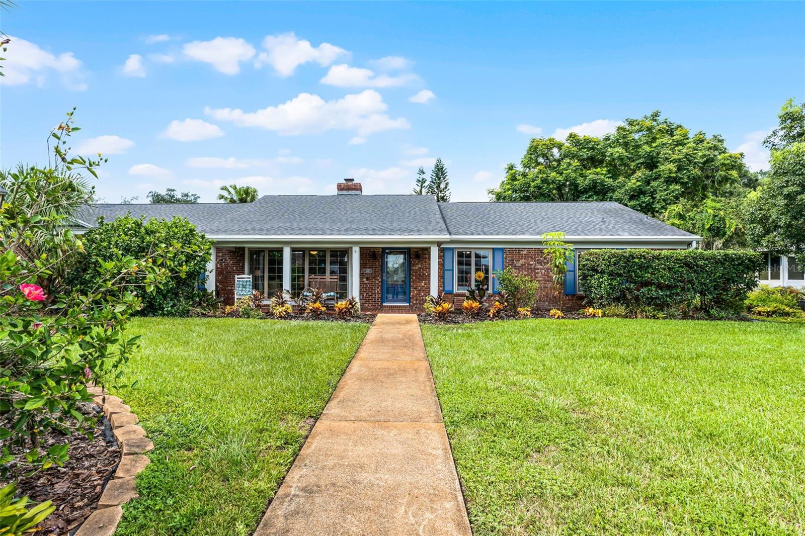 Welcome to this stunning 4-bedroom, 3-bathroom pool home nestled in the sought-after Spring Valley Farms community of Altamonte Springs. This classic red brick ranch home is a true gem, reflecting a Southern Charm curb appeal with its covered front porch, welcoming entryway with beautiful landscaping, and picture windows with blue painted shutters. This spacious home boasts 2,506 square feet of well-designed living space, with everything easily accessible on one level, and set on an expansive 0.41-acre lot with an attached two-car garage and gorgeous in-ground swimming pool. This home has it all!
Step outside to enjoy the large screened Florida room with overhead fans and swimming pool—perfect for relaxing or entertaining. The lush yard features a tropical paradise with mature landscaping that includes a variety of fruit trees, and a charming vegetable garden within a fully fenced yard for added privacy. A detached storage shed provides additional convenience.
Inside, you’ll find a formal living room, formal dining room, and a spacious family room with a cozy wood-burning fireplace. Decorative beams and trim work provide warmth and accentuate the open space. Large windows and French doors fill the home with natural light and offer seamless indoor-outdoor living.
The eat-in kitchen is equipped with porcelain tile flooring and built-in Jenn-air cooktop, stainless steel convection oven and microwave, making meal prep both stylish and functional. The kitchen and family room feature built-in shelves and plenty of storage. The primary suite includes a private en-suite bathroom, a generous walk-in closet, and direct access to a large laundry room—perfectly suited to double as a home office or nursery.
Additional features include a newer roof and two hot water heaters, ensuring peace of mind.
As a resident of Spring Valley Farms, you’ll have the option to join the HOA, which offers an array of amenities such as access to Spring Lake with a private dock and boat ramp, pickleball/tennis and basketball courts, volleyball, playgrounds, a covered picnic pavilion, and prime bass fishing spots.
Conveniently located just minutes from I-4, top-rated schools, shopping, dining, and local parks—this home truly has it all.
Don’t miss the opportunity to make this exceptional property your own. Schedule your private showing today!