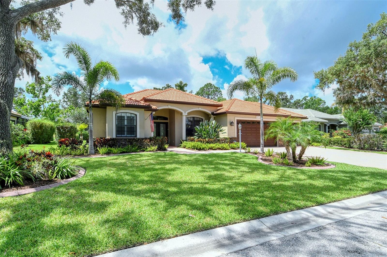 NATURE ABOUNDS in Secluded Oaks! This exceptional home features 4 bedrooms, 3 full bathrooms, 3-Car Garage and boasts one of the most private and exclusive lots in the neighborhood; with a coveted Southern Sun Exposure! The modern open floor plan and grand ceilings lead into a Gourmet Kitchen with granite counters, a newer Café Refrigerator. Natural gas is available. Hurricane Windows & Doors throughout.
You will never lack for entertainment with bountiful Wildlife to enjoy in your own backyard; imagine waking up with a 6 point buck grazing just beyond your lanai with the sandhill cranes passing-by just beyond him on the most beautiful lake in Sarasota! Generous private pool and spa with an upgraded pool pump, and heated. Location is not far from shopping, schools & a short distance to Siesta Key Beach, the #1 beach in U.S.A! LOW HOA fees, No CDD’s.